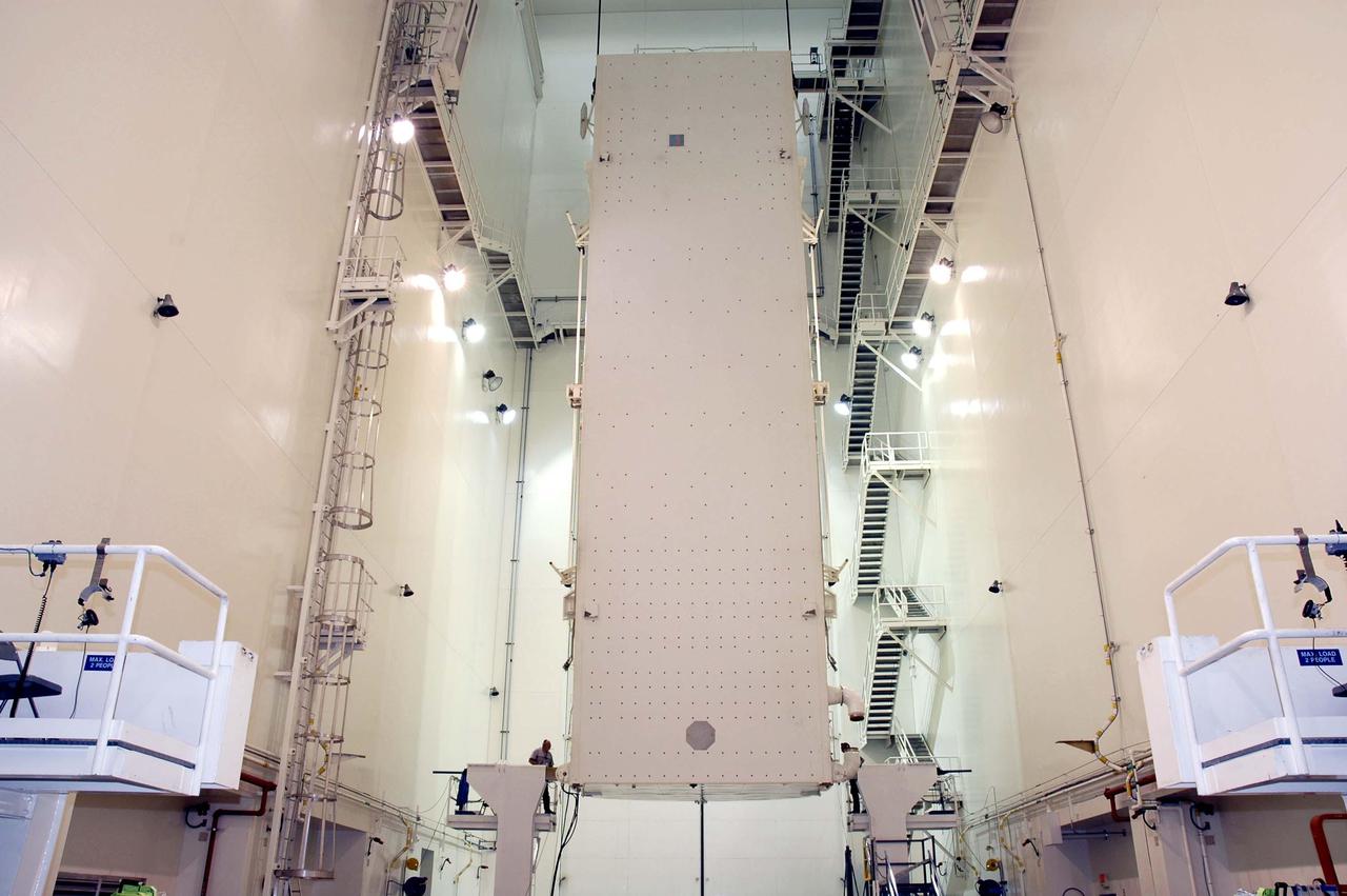 KENNEDY SPACE CENTER, FLA. - In the Canister Rotation Facility at NASA’s Kennedy Space Center, the Payload Canister has been raised to a vertical position for transport to Launch Pad 39B. The payloads inside, including the Multi-Purpose Logistics Module Raffaello and External Stowage Platform-2, will be moved into the Payload Changeout Room in the Rotating Service Structure and then installed in Discovery’s payload bay. Space Shuttle Discovery is scheduled to launch on Return to Flight mission STS-114 to the International Space Station. The launch window extends from May 22 to June 3.