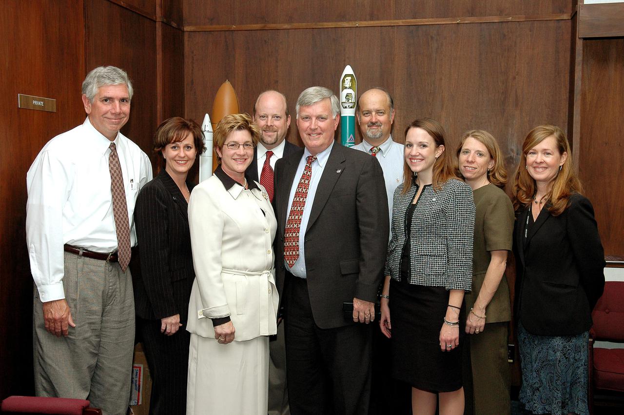 KENNEDY SPACE CENTER, FLA. - Members of the Economic Development Commission (EDC) of Florida’s Space Coast were on hand to witness the signing of a three-year agreement for economic development cooperation in support of existing and future missions of NASA at KSC. Lynda Weatherman (third from left), president and CEO of the EDC, and Jim Kennedy (center) , director of Kennedy Space Center, signed the Space Act Agreement. At far right is Lisa Malone, director of External Relations and Business Development at KSC. Standing with them are members of the NASA External Relations directorate who helped facilitate the Space Act Agreement are, from left, James Ball, Kim Agee, John Hudiberg, David Pierce, Jessica Livingston and Trudy McCarthy.