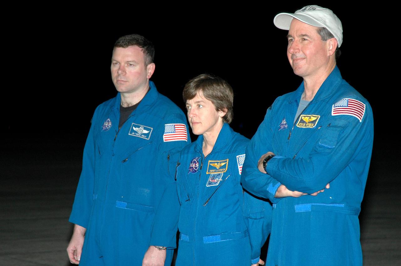 KENNEDY SPACE CENTER, FLA. - After arrival at NASA’s Kennedy Space Center, the STS-114 crew members pause on the runway while Commander Eileen Collins makes a brief statement to the media. Seen here are Pilot James Kelly and Mission Specialists Wendy Lawrence and Stephen Robinson. The crew is at KSC to take part in the Terminal Countdown Demonstration Test (TCDT) over the next three days. The TCDT is held at KSC prior to each Space Shuttle flight. It provides the crew of each mission an opportunity to participate in simulated countdown activities. The test ends with a mock launch countdown culminating in a simulated main engine cutoff. The crew also spends time undergoing emergency egress training exercises at the launch pad. STS-114 is the first Return to Flight mission to the International Space Station. The launch window extends July 13 through July 31.