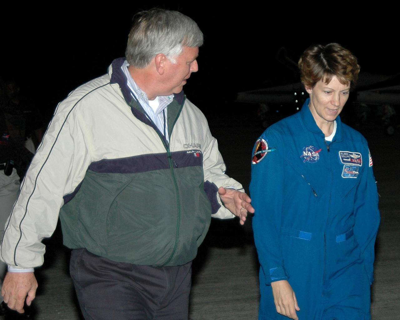 KENNEDY SPACE CENTER, FLA. - At Kennedy Space Center’s Shuttle Landing Facility, Center Director Jim Kennedy talks with STS-114 Commander Eileen Collins after her arrival. She and the rest of the crew are at KSC to take part in the Terminal Countdown Demonstration Test (TCDT) over the next three days. The TCDT is held at KSC prior to each Space Shuttle flight. It provides the crew of each mission an opportunity to participate in simulated countdown activities. The test ends with a mock launch countdown culminating in a simulated main engine cutoff. The crew also spends time undergoing emergency egress training exercises at the launch pad. This is Collins’ fourth space flight and second as commander. STS-114 is the first Return to Flight mission to the International Space Station. The launch window extends July 13 through July 31.