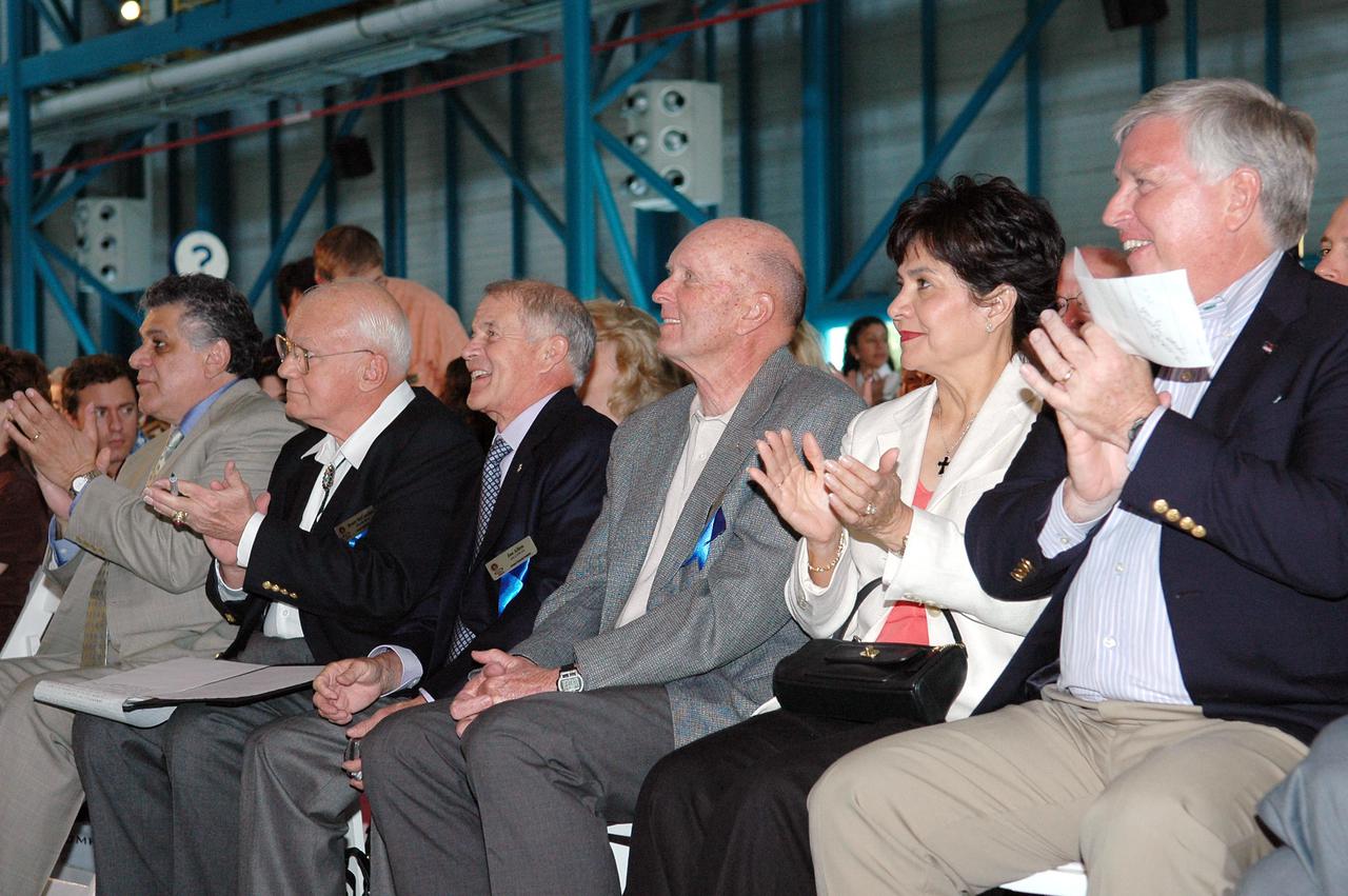 KENNEDY SPACE CENTER, FLA. -  A crowd of 1,000 were on hand April 30, 2005, in Kennedy Space Center Visitor Complex’s Apollo_Saturn V Center to witness the induction of three more astronauts into the elite Astronaut Hall of Fame.  Here, the new inductees Bruce McCandless (second from left), Joe Allen and Gordon Fullerton are seated with Jim Kennedy (far right), who is director of Kennedy Space Center, and his wife, Bernadette.  Recognized for their individual flight accomplishments and contributions to the success and future success of the U.S. space program, this elite group of inductees is among only 60 astronauts to be honored in the Hall of Fame and the fourth group of Space Shuttle astronauts named.