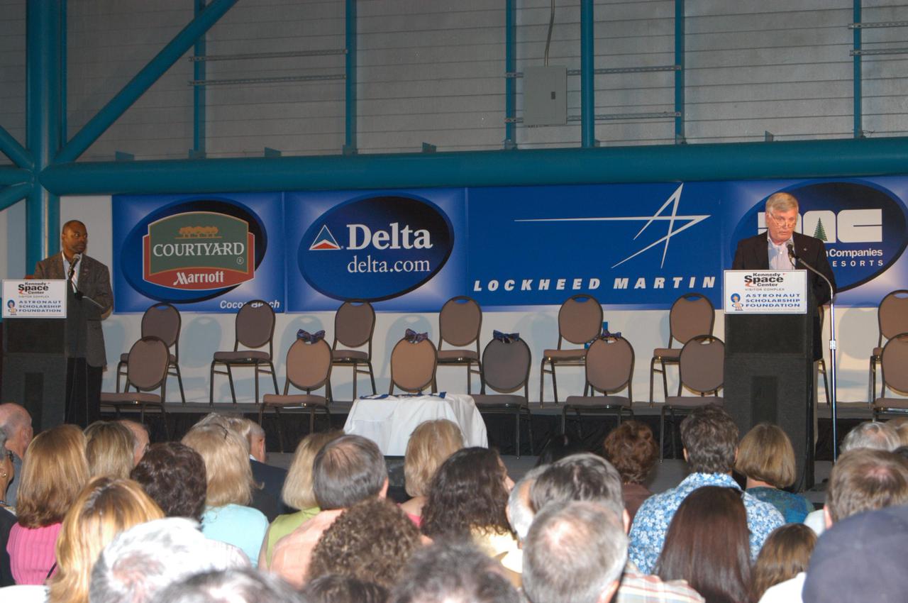 KENNEDY SPACE CENTER, FLA. -  Kennedy Space Center Director Jim Kennedy talks to inductees and guests at the Astronaut Hall of Fame Induction ceremony held in Kennedy Space Center Visitor Complex’s Apollo_Saturn V Center. At far left is the master of ceremonies, LeVar Burton, who starred in the television series “Star Trek: The Next Generation.”  The new inductees are Bruce McCandless, Joe Allen and Gordon Fullerton.  Recognized for their individual flight accomplishments and contributions to the success and future success of the U.S. space program, this elite group of inductees is among only 60 astronauts to be honored in the Hall of Fame and the fourth group of Space Shuttle astronauts named.