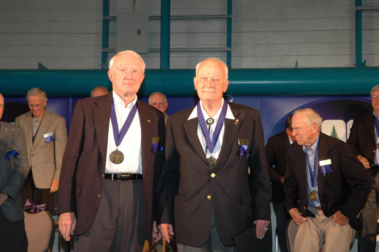 KENNEDY SPACE CENTER, FLA. -  At the Astronaut Hall of Fame Induction Ceremony, new inductees Joe Allen (left) and Bruce McCandless stand before the guests at the Kennedy Space Center Visitor Complex’s Apollo_Saturn V Center.  Other inductee Gordon Fullerton is not pictured.   Recognized for their individual flight accomplishments and contributions to the success and future success of the U.S. space program, this elite group of inductees is among only 60 astronauts to be honored in the Hall of Fame and the fourth group of Space Shuttle astronauts named.