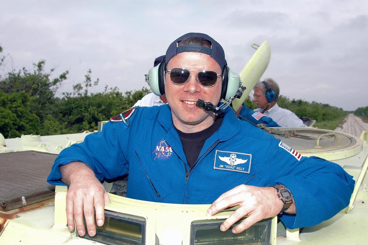 KENNEDY SPACE CENTER, FLA. - During Terminal Countdown Demonstration Test (TCDT) activities at NASA’s Kennedy Space Center, STS-114 Pilot James Kelly is ready to practice driving an M-113, an armored personnel carrier that is used for speedy departure from the launch pad in an emergency. The TCDT is held at KSC prior to each Space Shuttle flight. It provides the crew of each mission an opportunity to participate in simulated countdown activities. The test ends with a mock launch countdown culminating in a simulated main engine cutoff. The crew also spends time undergoing emergency egress training exercises at the launch pad. STS-114 is the first Return to Flight mission to the International Space Station. The launch window extends July 13 through July 31.