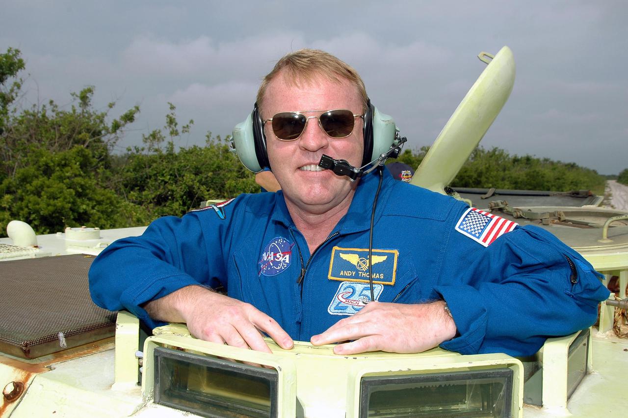 KENNEDY SPACE CENTER, FLA. - During Terminal Countdown Demonstration Test (TCDT) activities at NASA’s Kennedy Space Center, STS-114 Mission Specialist Andrew Thomas is ready to practice driving an M-113, an armored personnel carrier that is used for speedy departure from the launch pad in an emergency. The TCDT is held at KSC prior to each Space Shuttle flight. It provides the crew of each mission an opportunity to participate in simulated countdown activities. The test ends with a mock launch countdown culminating in a simulated main engine cutoff. The crew also spends time undergoing emergency egress training exercises at the launch pad. STS-114 is the first Return to Flight mission to the International Space Station. The launch window extends July 13 through July 31.