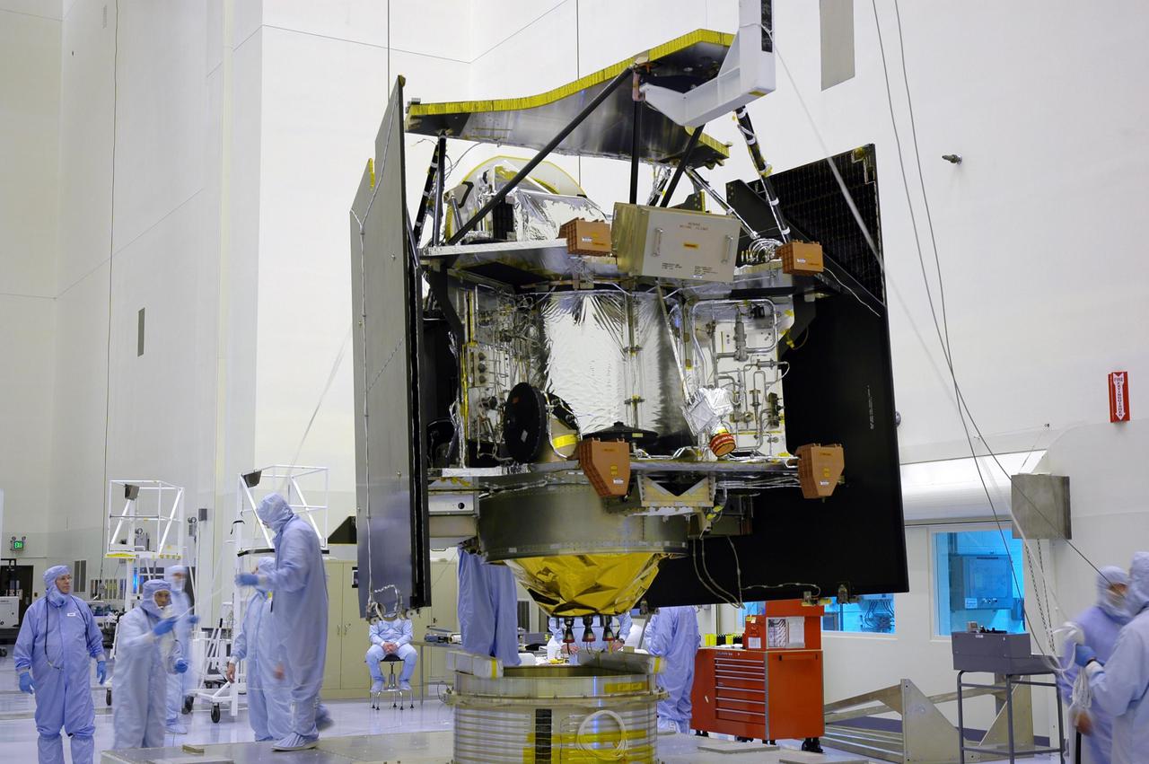KENNEDY SPACE CENTER, FLA. -In a clean room inside the Payload Hazardous Servicing Facility (PHSF) at NASA’s Kennedy Space Center, the Mars Reconnaissance Orbiter (MRO) is lifted by an overhead crane to move it to a nearby workstand for final assembly and testing. In the PHSF, the spacecraft will undergo multiple mechanical assembly operations and electrical tests to verify its readiness for launch. A test this month will verify the spacecraft’s ability to communicate through NASA's Deep Space Network tracking stations. A June test will check the deployment of the spacecraft's high gain communications antenna. Another major deployment test will check out the spacecraft's large solar arrays. The MRO was built for NASA’s Jet Propulsion Laboratory in California. It is the next major step in Mars exploration and scheduled for launch from Cape Canaveral Air Force Station in a window opening Aug. 10. The MRO is an important next step in fulfilling NASA’s vision of space exploration and ultimately sending human explorers to Mars and beyond.