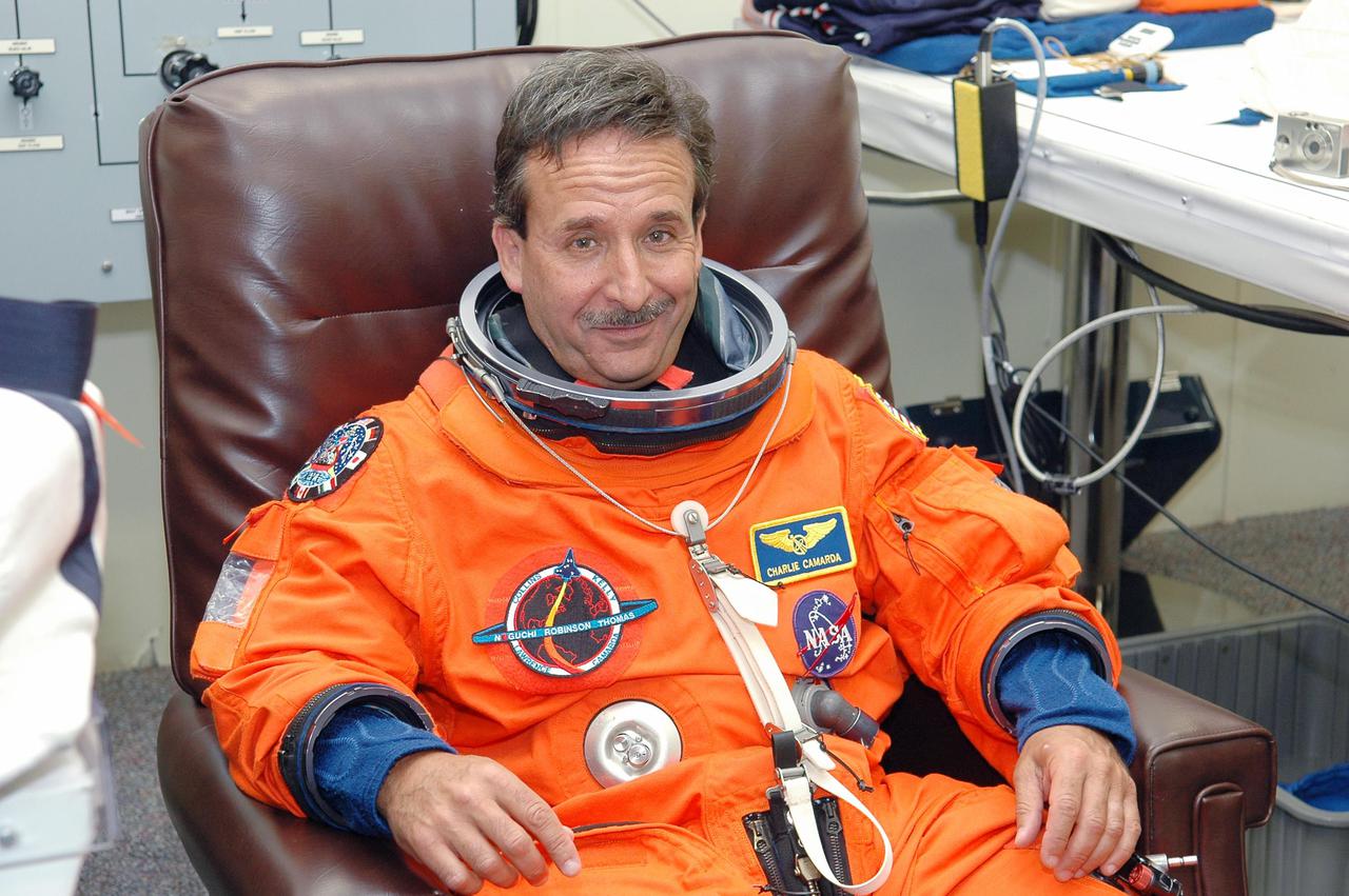 KENNEDY SPACE CENTER, FLA. - As part of pre-pack and fit check for Terminal Countdown Demonstration Test (TCDT) activities, STS-114 Mission Specialist Charles Camarda has his launch suit checked for fit. The TCDT is held at KSC prior to each Space Shuttle flight. It provides the crew of each mission an opportunity to participate in simulated countdown activities. The test ends with a mock launch countdown culminating in a simulated main engine cutoff. The crew also spends time undergoing emergency egress training exercises at the launch pad. STS-114 is the first Return to Flight mission to the International Space Station. The launch window extends July 13 through July 31.