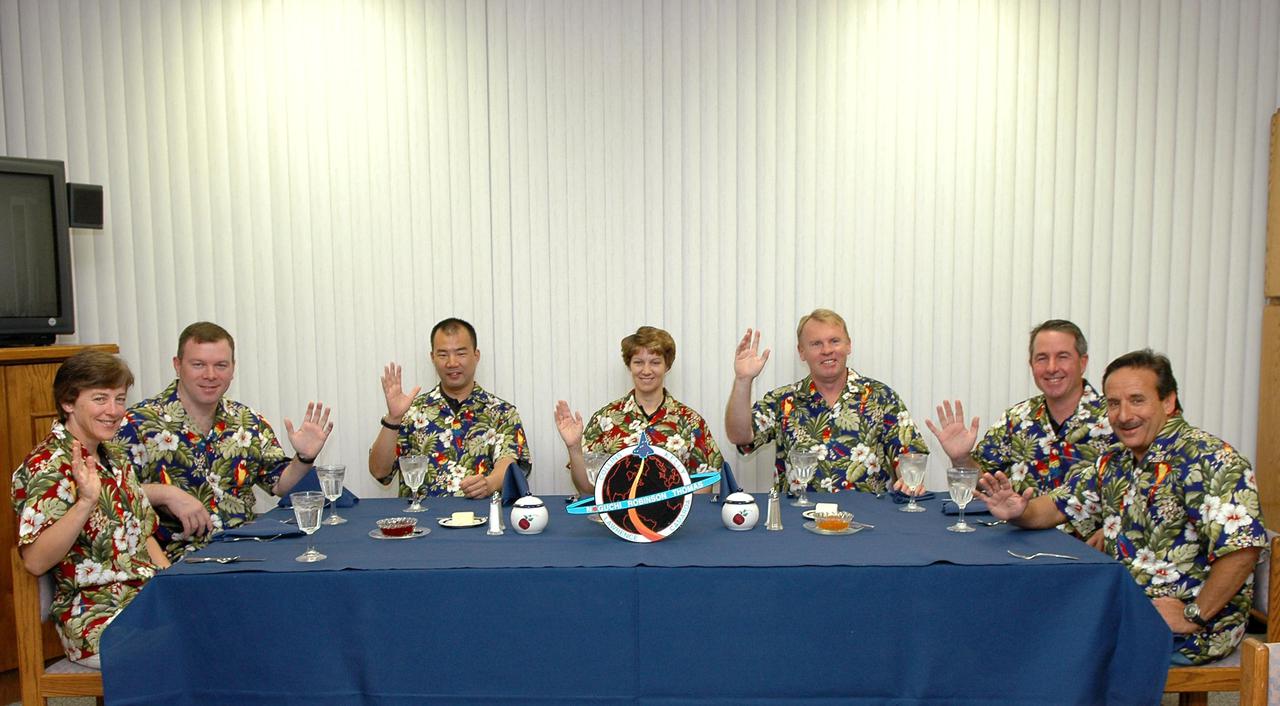 KENNEDY SPACE CENTER, FLA. - The STS-114 crew partakes of the traditional breakfast in the crew quarters at the Operations and Checkout (OandC) Building prior to suit-up for the trip to Launch Pad 39B for a mock launch countdown culminating in a simulated main engine cutoff. Seated, from left, are Mission Specialist Wendy Lawrence, Pilot James Kelly, Mission Specialist Soichi Noguchi, Commander Eileen Collins, and Mission Specialists Andrew Thomas, Stephen Robinson, and Charles Camarda. Noguchi is with the Japan Aerospace Exploration Agency. The dress rehearsal is part of Terminal Countdown Demonstration Test (TCDT) activities held prior to each Space Shuttle flight. It provides the crew of each mission an opportunity to participate in various simulated countdown activities, including equipment familiarization and emergency egress training. STS-114 is the first Return to Flight mission to the International Space Station. The launch window extends July 13 through July 31.