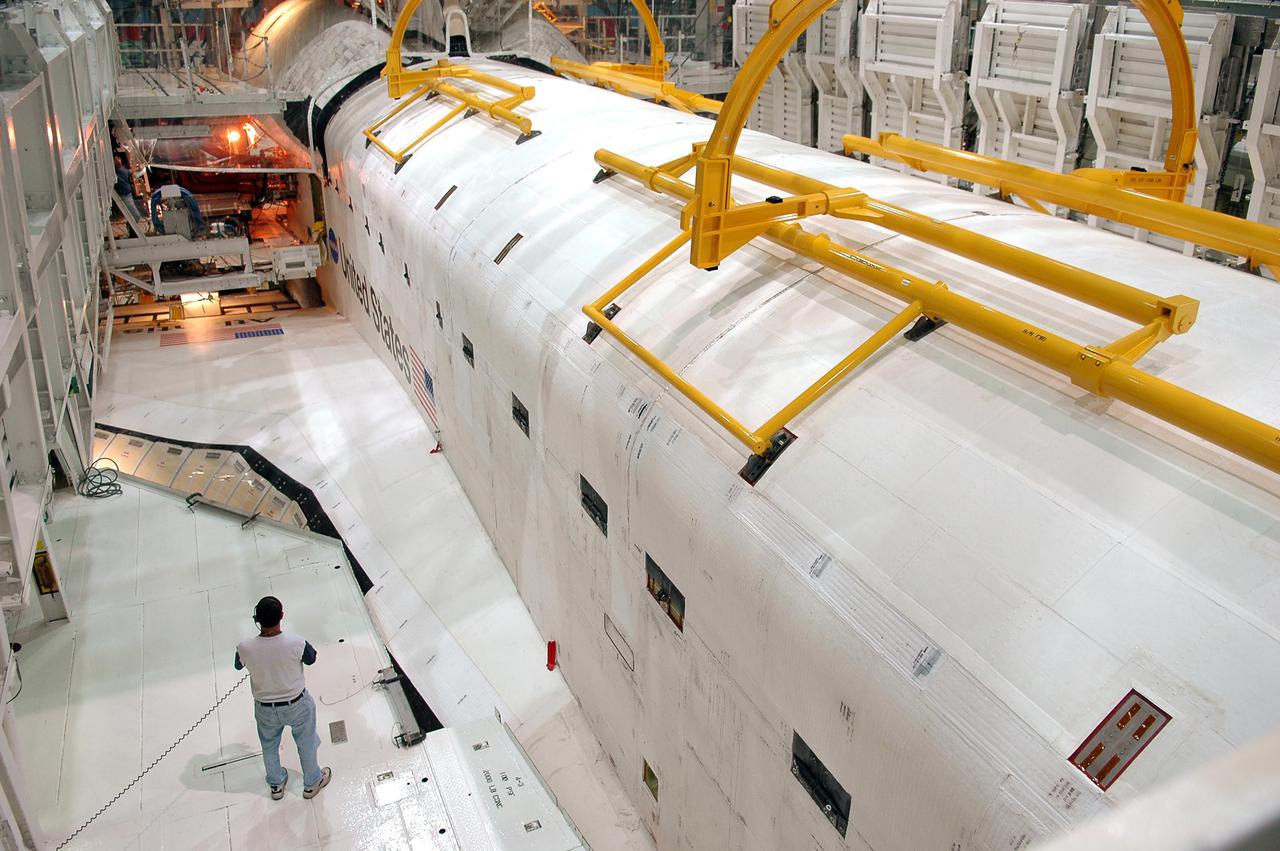 KENNEDY SPACE CENTER, FLA. - In Orbiter Processing Facility bay 1 at NASA’s Kennedy Space Center, Atlantis’ payload bay doors are being opened. The payload bay doors were closed for a clearance check on the Orbiter Boom Sensor System (OBSS), built in Canada.  The 50-foot-long OBSS attaches to the Remote Manipulator System, or Shuttle arm, and is one of the new safety measures for Return to Flight.  It equips the orbiter with cameras and laser systems to inspect the Shuttle’s Thermal Protection System while in space.  Mission STS-121 is targeted for launch in September.  Once the bay doors are open again, further work will be done in the bay.