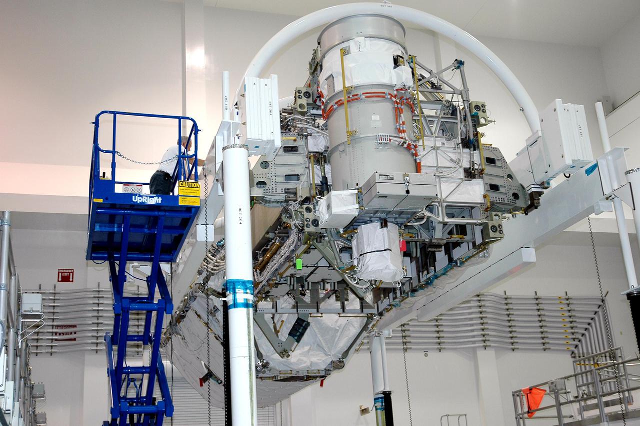 KENNEDY SPACE CENTER, FLA. - In the Space Station Processing Facility at NASA’s Kennedy Space Center, the P3_P4 Truss is being prepared to be rotated to the upper deck position in preparation for installation of the upper deck solar array wing. The truss is scheduled to launch on mission 12A, STS-115, to the International Space Station. The wing was removed to replace aging flight batteries. New batteries are being installed to ensure that the batteries do not exceed their lifetime expectancy prior to their planned logistics resupply on-orbit. The new batteries have a lifetime expectancy of approximately 7 years.