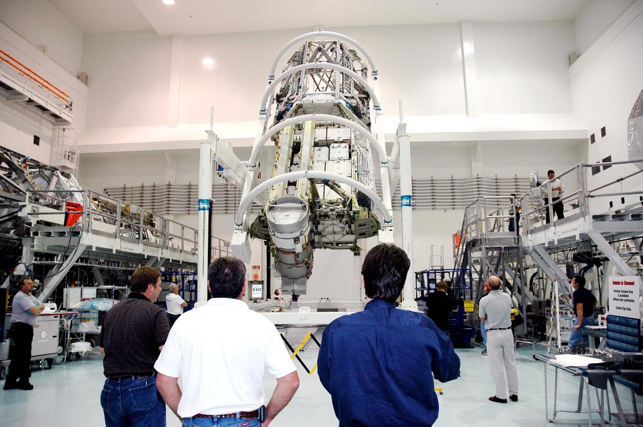 KENNEDY SPACE CENTER, FLA. -In the Space Station Processing Facility at NASA’s Kennedy Space Center, the P3_P4 Truss is rotated to the upper deck position in preparation for installation of the upper deck solar array wing. The truss is scheduled to launch on mission 12A, STS-115, to the International Space Station. The wing was removed to replace aging flight batteries. New batteries are being installed to ensure that the batteries do not exceed their lifetime expectancy prior to their planned logistics resupply on-orbit. The new batteries have a lifetime expectancy of approximately 7 years.