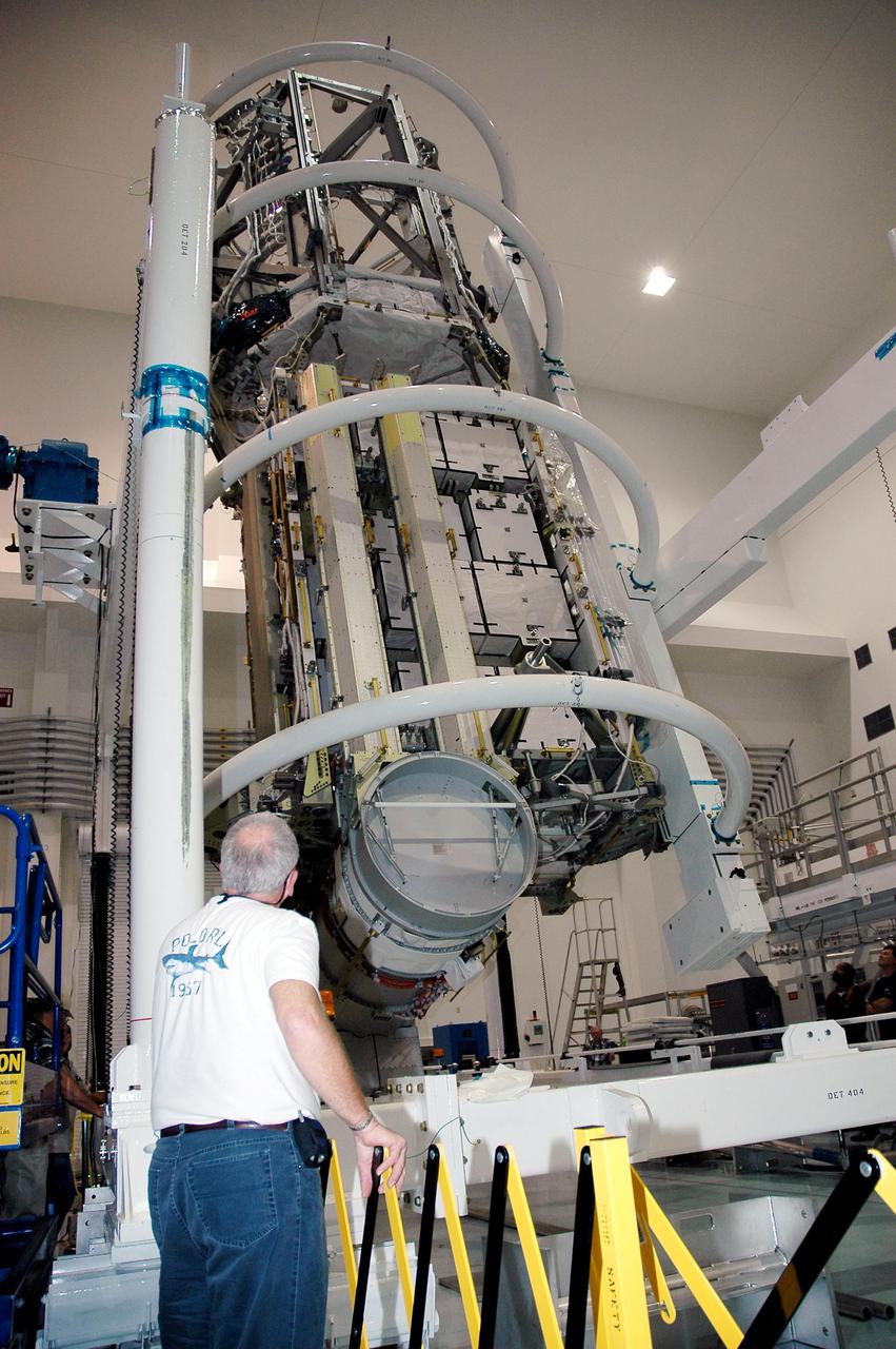 KENNEDY SPACE CENTER, FLA. - In the Space Station Processing Facility at NASA’s Kennedy Space Center, the P3_P4 Truss is rotated to the upper deck position in preparation for installation of the upper deck solar array wing. The truss is scheduled to launch on mission 12A, STS-115, to the International Space Station. The wing was removed to replace aging flight batteries. New batteries are being installed to ensure that the batteries do not exceed their lifetime expectancy prior to their planned logistics resupply on-orbit. The new batteries have a lifetime expectancy of approximately 7 years.
