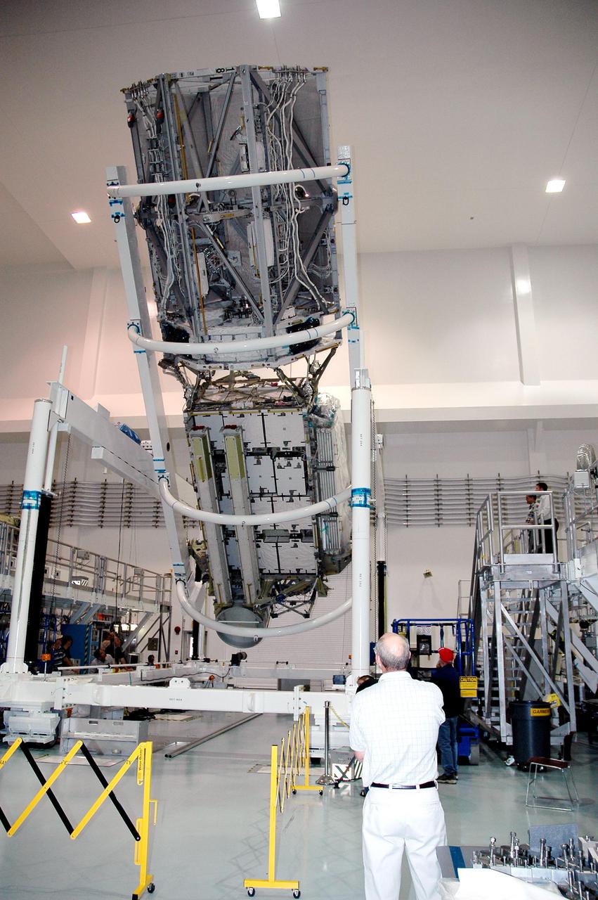 KENNEDY SPACE CENTER, FLA. - In the Space Station Processing Facility at NASA’s Kennedy Space Center, the P3_P4 Truss is rotated to the upper deck position in preparation for installation of the upper deck solar array wing. The truss is scheduled to launch on mission 12A, STS-115, to the International Space Station. The wing was removed to replace aging flight batteries. New batteries are being installed to ensure that the batteries do not exceed their lifetime expectancy prior to their planned logistics resupply on-orbit. The new batteries have a lifetime expectancy of approximately 7 years.