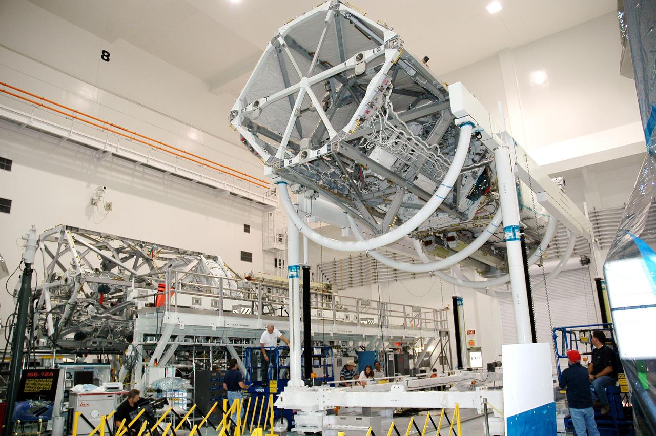 KENNEDY SPACE CENTER, FLA. - In the Space Station Processing Facility at NASA’s Kennedy Space Center, the P3_P4 Truss has been rotated to the upper deck position in preparation for installation of the upper deck solar array wing. The truss is scheduled to launch on mission 12A, STS-115, to the International Space Station. The wing was removed to replace aging flight batteries. New batteries are being installed to ensure that the batteries do not exceed their lifetime expectancy prior to their planned logistics resupply on-orbit. The new batteries have a lifetime expectancy of approximately 7 years.