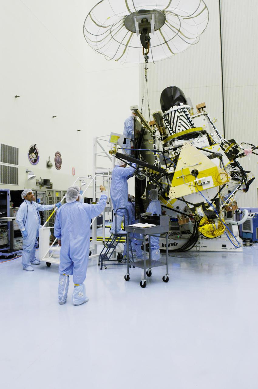 KENNEDY SPACE CENTER, FLA. - In the Payload Hazardous Servicing Facility, workers are removing the solar panel from the Mars Reconnaissance Orbiter spacecraft. A major deployment test will check out the spacecraft’s large solar arrays. The spacecraft will also undergo multiple mechanical assembly operations and electrical tests to verify its readiness for launch. The MRO was built by Lockheed Martin for NASA’s Jet Propulsion Laboratory in California. It is the next major step in Mars exploration and scheduled for launch from Cape Canaveral Air Force Station in a window opening Aug. 10. The MRO is an important next step in fulfilling NASA’s vision of space exploration and ultimately sending human explorers to Mars and beyond.