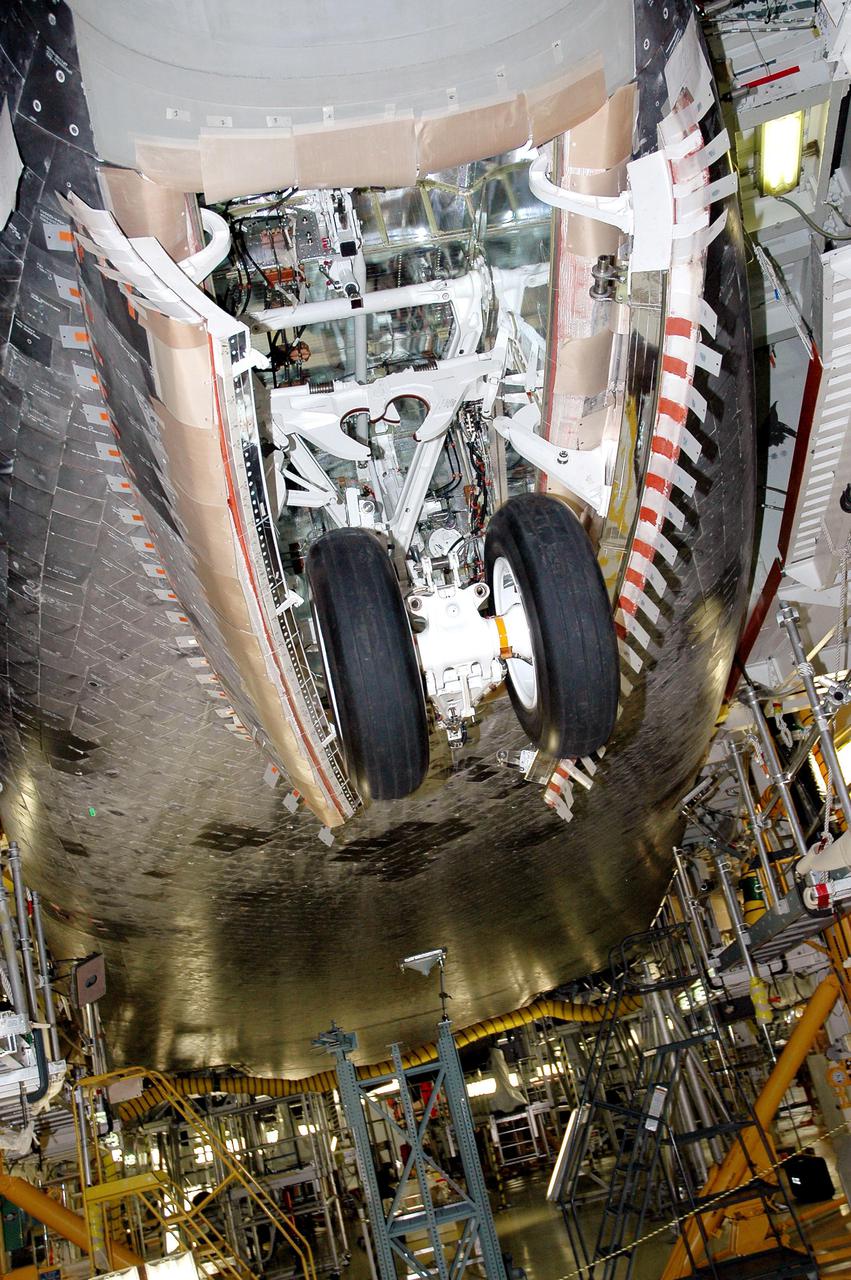 KENNEDY SPACE CENTER, FLA. - In the Orbiter Processing Facility bay 1 at NASA’s Kennedy Space Center in Florida, Atlantis’ nose wheels are cycled to test compression of the new Thermal Protection System seal.  Processing continues on Atlantis for mission STS-121 to the International Space Station.  The second Return to Flight mission, STS-121 is scheduled for liftoff in a launch window extending from Sept. 9 - 24.