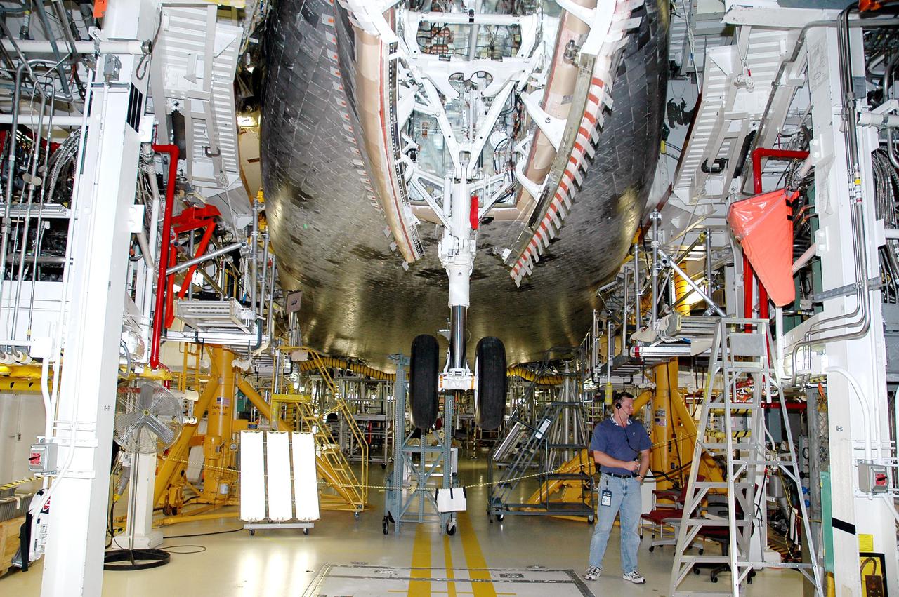 KENNEDY SPACE CENTER, FLA. - In the Orbiter Processing Facility bay 1 at NASA’s Kennedy Space Center in Florida, Atlantis’ nose wheels are cycled to test compression of the new Thermal Protection System seal.  Processing continues on Atlantis for mission STS-121 to the International Space Station.  The second Return to Flight mission, STS-121 is scheduled for liftoff in a launch window extending from Sept. 9 - 24.