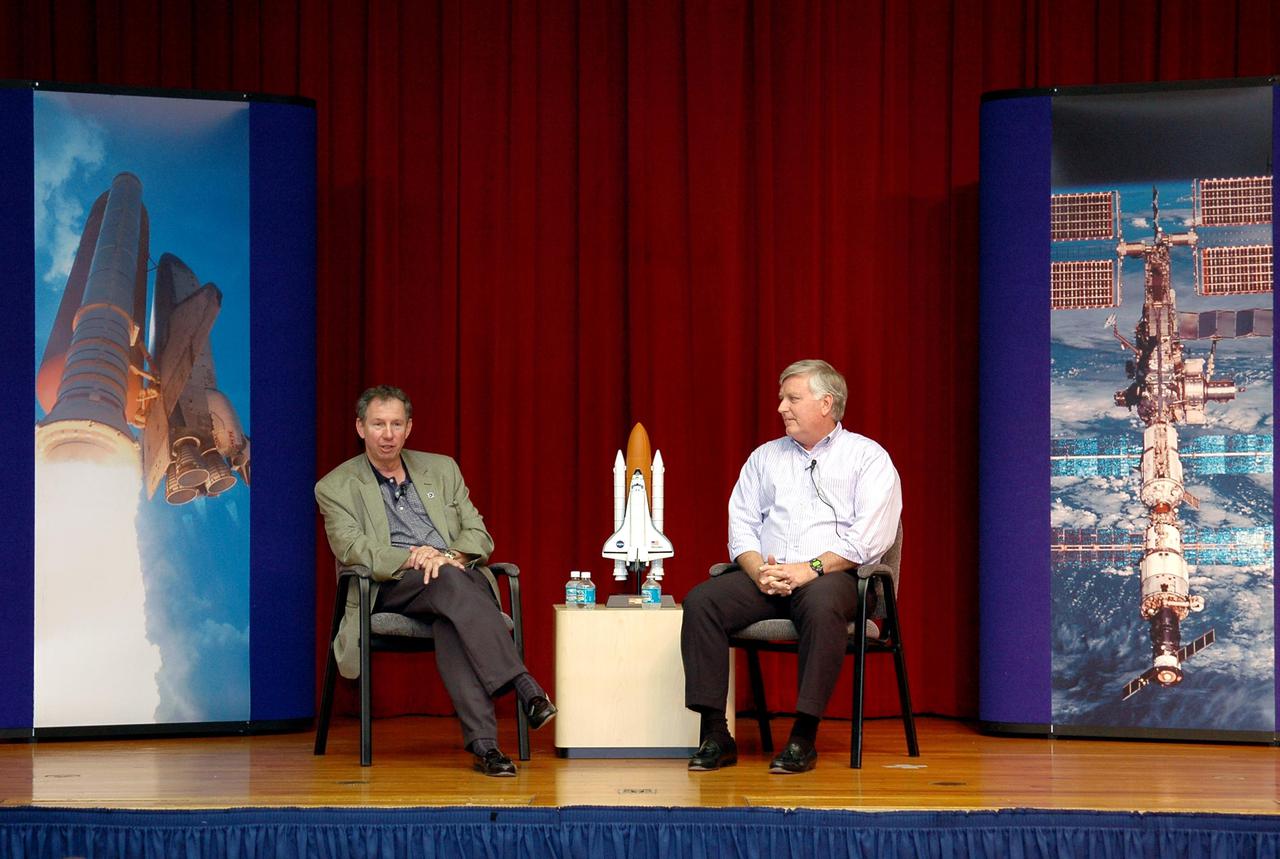 KENNEDY SPACE CENTER, FLA. - Michael Griffin (left), administrator of the National Aeronautics and Space Administration (NASA), and James Kennedy, director of the John F. Kennedy Space Center (KSC), address KSC employees during a Town Hall meeting. The meeting was held in the Training Auditorium and broadcast around the Center to employees not in attendance. This is Griffin's first official visit to Kennedy Space Center. Griffin is the 11th administrator of NASA, a role he assumed on April 14, 2005. Griffin was nominated to the position in March while serving as the Space Department head at Johns Hopkins University's Applied Physics Laboratory in Baltimore. A registered professional engineer in Maryland and California, Griffin served as chief engineer at NASA earlier in his career. He holds numerous scientific and technical degrees including a Ph.D. in Aerospace Engineering from the University of Maryland.