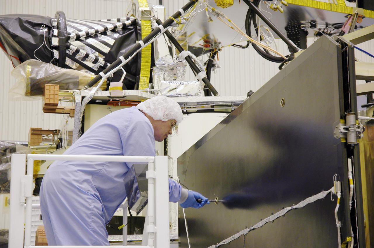 KENNEDY SPACE CENTER, FLA. - In the Payload Hazardous Servicing Facility, a technician prepares the solar arrays for the Mars Reconnaissance Orbiter (MRO) for an electromagnetic interference verification test.  If no interference is found during the test, the Shallow Radar Antenna (SHARAD) will be installed on the spacecraft. The spacecraft is undergoing multiple mechanical assembly operations and electrical tests to verify its readiness for launch. The MRO was built by Lockheed Martin for NASA’s Jet Propulsion Laboratory in California. It is the next major step in Mars exploration and scheduled for launch from Launch Complex 41 at Cape Canaveral Air Force Station in a window opening Aug. 10. The MRO is an important next step in fulfilling NASA’s vision of space exploration and ultimately sending human explorers to Mars and beyond.