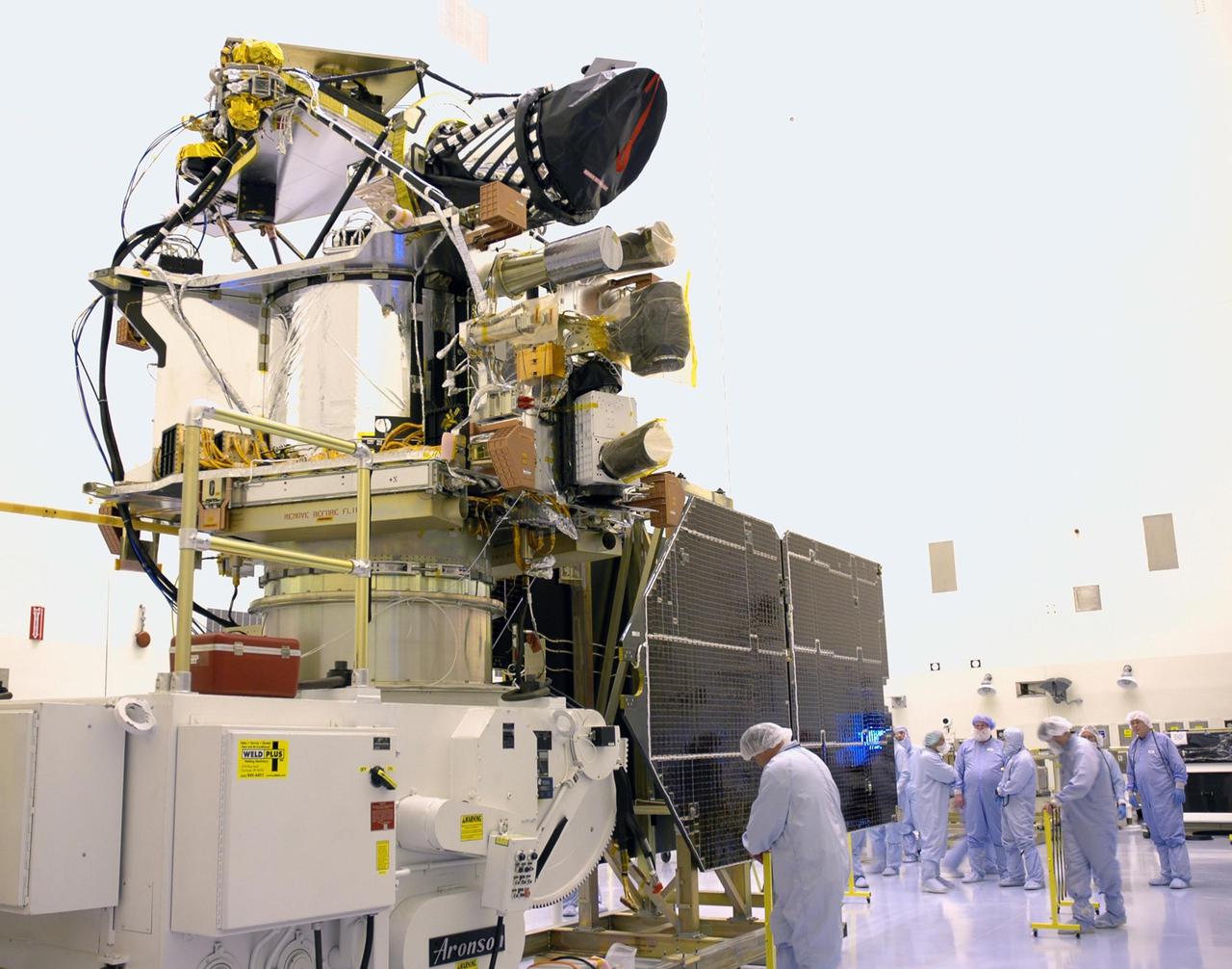 KENNEDY SPACE CENTER, FLA. - In the Payload Hazardous Servicing Facility, technicians prepare to conduct an electromagnetic interference verification test using the solar arrays for the Mars Reconnaissance Orbiter (MRO) and an antenna simulator.  If no interference is found during the test, the Shallow Radar Antenna (SHARAD) will be installed on the spacecraft. The spacecraft is undergoing multiple mechanical assembly operations and electrical tests to verify its readiness for launch. The MRO was built by Lockheed Martin for NASA’s Jet Propulsion Laboratory in California. It is the next major step in Mars exploration and scheduled for launch from Launch Complex 41 at Cape Canaveral Air Force Station in a window opening Aug. 10. The MRO is an important next step in fulfilling NASA’s vision of space exploration and ultimately sending human explorers to Mars and beyond.