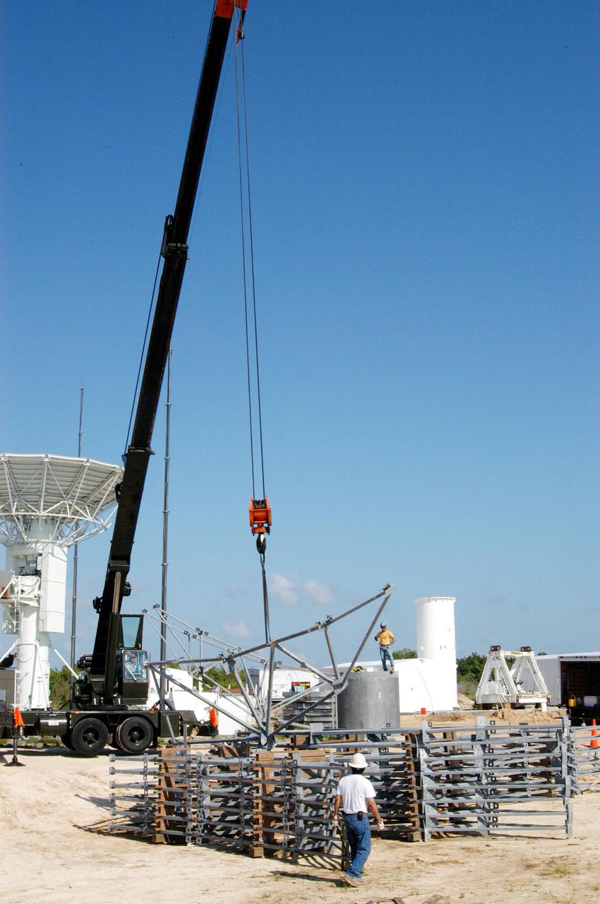 KENNEDY SPACE CENTER, FLA. - At a radar site on North Merritt Island, Fla., north of the Haulover Canal, a 50-foot dish for NASA’s C-band radar is being assembled. The radar will be used for long-term Shuttle missions to track the launches and observe possible debris coming from the Shuttle. At left is an existing 30-foot C-band Pathfinder radar whose use was demonstrated on the Delta Messenger launch. It will be used on the upcoming two Return to Flight missions. The launch window for the first Return to Flight mission, STS-114, is July 13 to July 31.