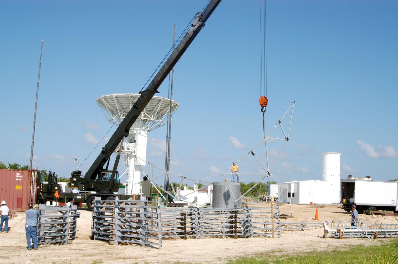 KENNEDY SPACE CENTER, FLA. - At a radar site on North Merritt Island, Fla., north of the Haulover Canal, a 50-foot dish for NASA’s C-band radar is being assembled. The radar will be used for long-term Shuttle missions to track the launches and observe possible debris coming from the Shuttle. Behind the dish is an existing 30-foot C-band Pathfinder radar whose use was demonstrated on the Delta Messenger launch. It will be used on the upcoming two Return to Flight missions. The launch window for the first Return to Flight mission, STS-114, is July 13 to July 31.