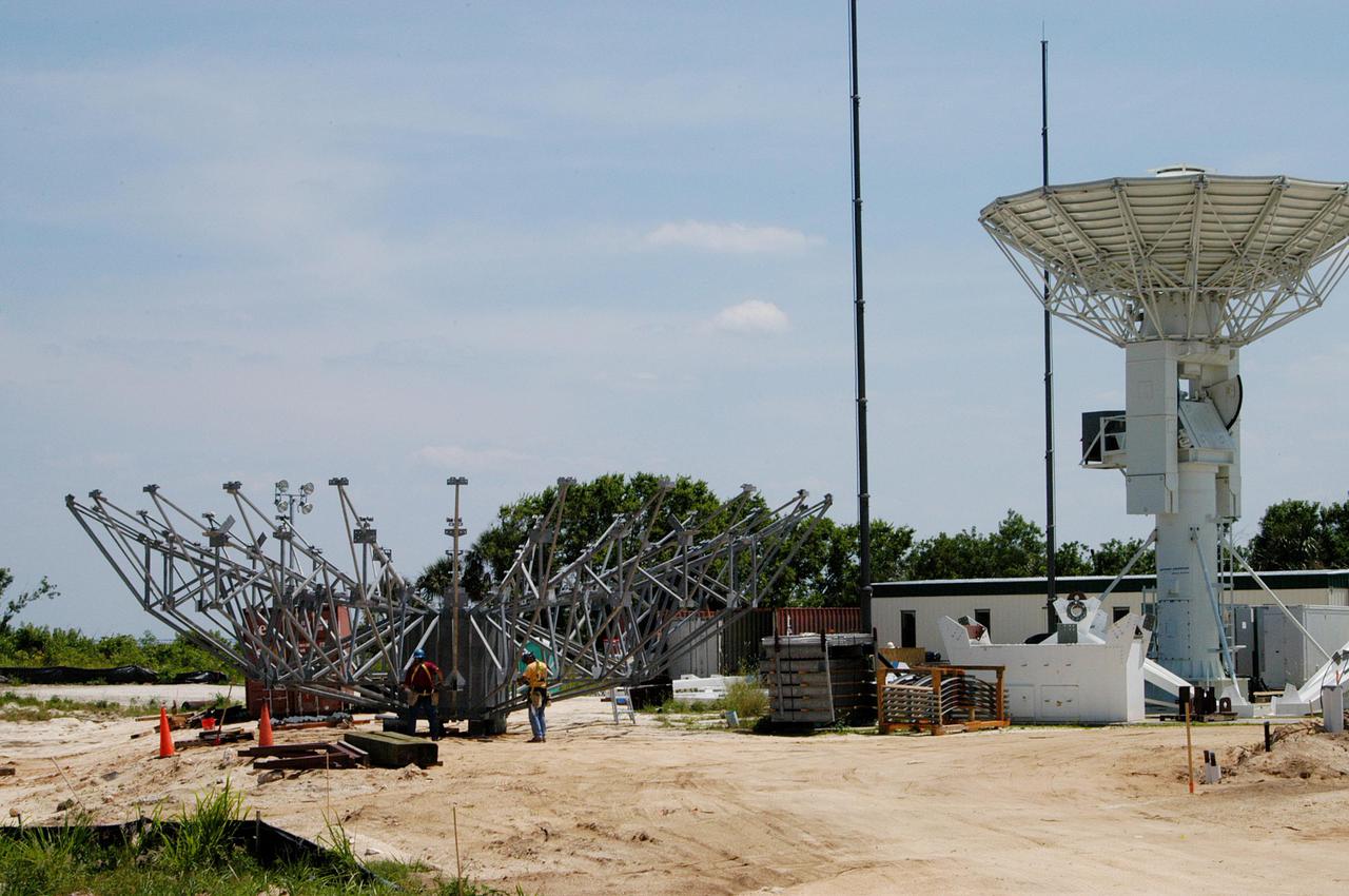 KENNEDY SPACE CENTER, FLA. - At a radar site on North Merritt Island, Fla., north of the Haulover Canal, a 50-foot dish for NASA’s C-band radar is being assembled. The radar will be used for long-term Shuttle missions to track the launches and observe possible debris coming from the Shuttle. On the right is an existing 30-foot C-band Pathfinder radar whose use was demonstrated on the Delta Messenger launch. It will be used on the upcoming two Return to Flight missions. The launch window for the first Return to Flight mission, STS-114, is July 13 to July 31.