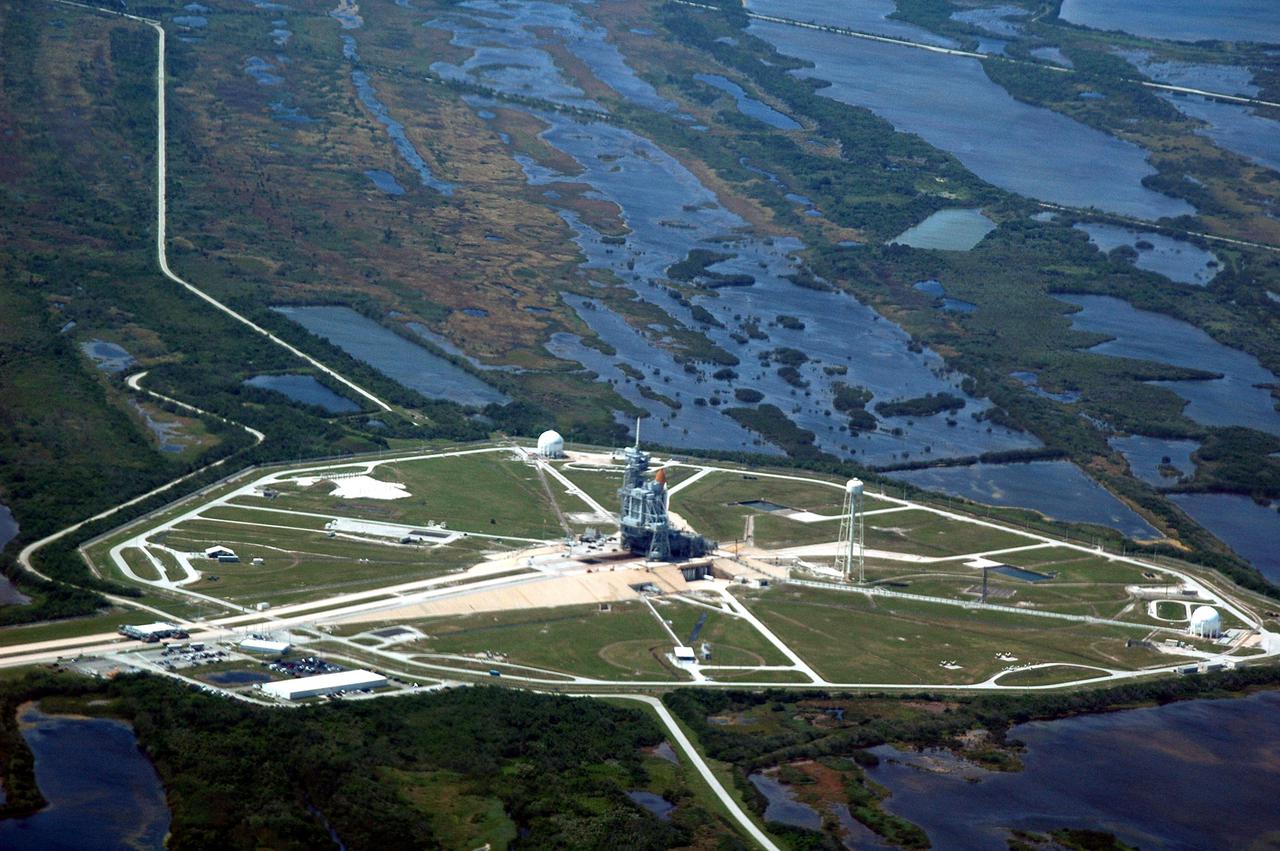 KENNEDY SPACE CENTER, FLA.  -  An aerial view of Launch Pad 39B and surrounding area at NASA's Kennedy Space Center, showing the Space Shuttle Discovery at center.  This is one of a series of photos shot cross-cockpit from a NASA Gulfstream 2.  Photo Credit: NASA_Richard Clark. (JSC2005-E-16172)