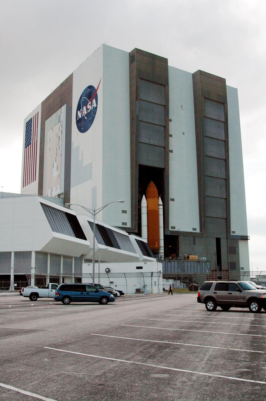 KENNEDY SPACE CENTER, FLA. - Space Shuttle Discovery, atop a Mobile Launcher Platform, rolls into high bay 1 in the Vehicle Assembly Building (VAB) at NASA’s Kennedy Space Center. The Shuttle is being rolled back from Launch Pad 39B. Once inside the VAB, Discovery will be demated from its External Tank and lifted into the transfer aisle. On or about June 7, Discovery will be lifted and attached to its new tank and Solid Rocket Boosters, which are already in the VAB. Only the 15th rollback in Space Shuttle Program history, the 4.2-mile journey allows additional modifications to be made to the External Tank prior to a safe Return to Flight. Discovery is expected to be rolled back to the launch pad in mid-June for Return to Flight mission STS-114. The launch window extends from July 13 to July 31.