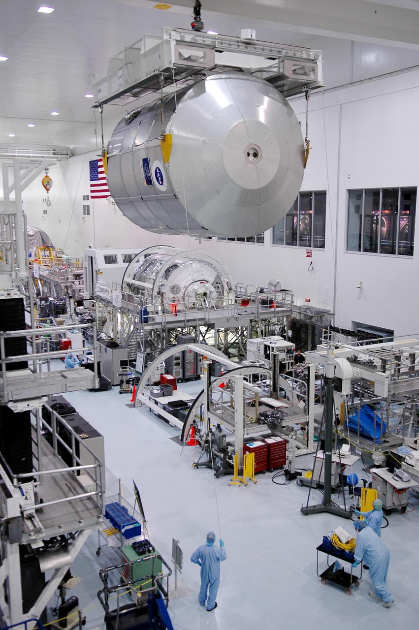 KENNEDY SPACE CENTER, FLA. - In the Space Station Processing Facility at NASA’s Kennedy Space Center, the Multi-Purpose Logistics Module Raffaello moves across the room to a work stand. The module is being moved back to its work stand to allow the processing team access in order to address concerns with mechanical fasteners inside the module that do not incorporate an adequate secondary locking feature. The assessment and additional work is being conducted to ensure that the fasteners do not disengage during ascent. Raffaello is scheduled to launch on Discovery's Return to Flight mission STS-114.