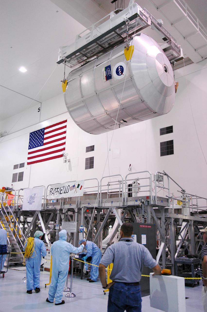 KENNEDY SPACE CENTER, FLA. - In the Space Station Processing Facility at NASA’s Kennedy Space Center, the Multi-Purpose Logistics Module Raffaello is lowered toward its work stand. The module is being moved to allow the processing team access in order to address concerns with mechanical fasteners inside the module that do not incorporate an adequate secondary locking feature. The assessment and additional work is being conducted to ensure that the fasteners do not disengage during ascent. Raffaello is scheduled to launch on Discovery's Return to Flight mission STS-114.