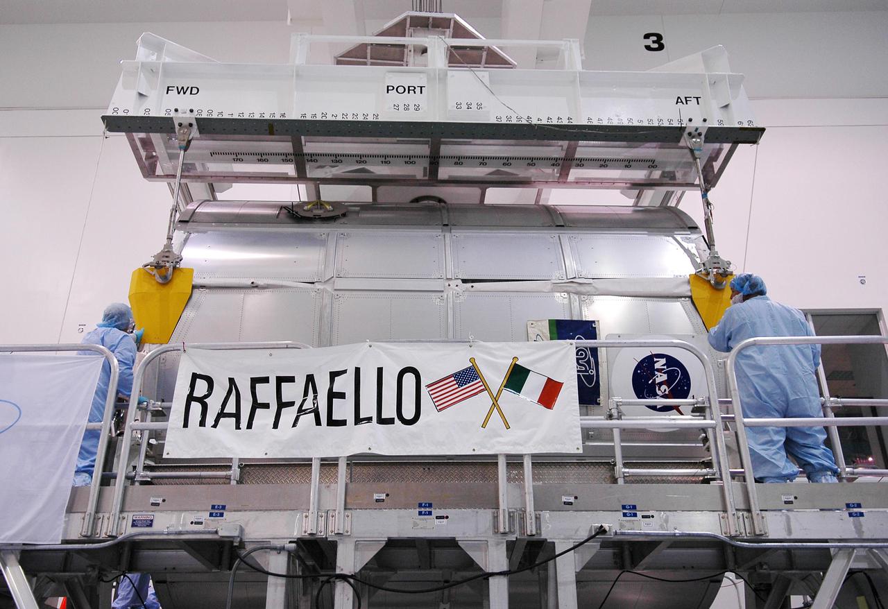 KENNEDY SPACE CENTER, FLA. - In the Space Station Processing Facility at NASA’s Kennedy Space Center, the Multi-Purpose Logistics Module Raffaello is lowered onto its work stand. The module is being moved to allow the processing team access in order to address concerns with mechanical fasteners inside the module that do not incorporate an adequate secondary locking feature. The assessment and additional work is being conducted to ensure that the fasteners do not disengage during ascent. Raffaello is scheduled to launch on Discovery's Return to Flight mission STS-114.