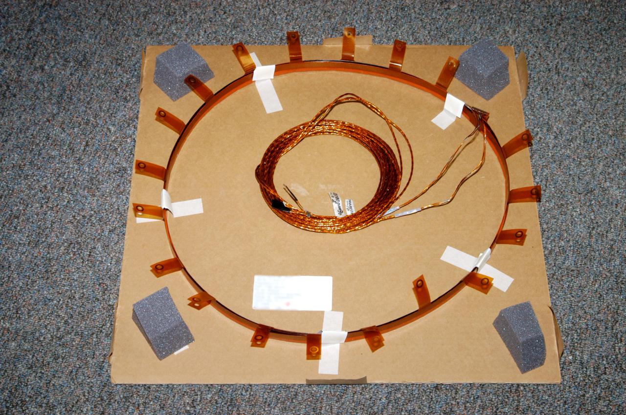 KENNEDY SPACE CENTER, FLA. - Displayed in the Vehicle Assembly Building at NASA’s Kennedy Space Center is a similar heating element to one recently attached to the liquid hydrogen feedline bellows on External Tank 121. The tank will be used on the orbiter Discovery for Return to Flight mission STS-114, which has a launch window extending from July 13 to July 31.