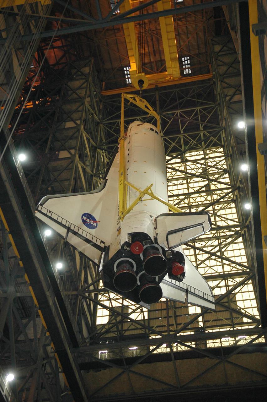 KENNEDY SPACE CENTER, FLA. - In high bay 1 of the Vehicle Assembly Building at NASA’s Kennedy Space Center, the 122-foot-long orbiter Discovery is suspended more than 400 feet above the floor after being lifted away from the 154-foot-high External Tank (below) and Solid Rocket Boosters. After demating from its External Tank (ET), the orbiter will be placed on a transporter in the transfer aisle and moved to high bay 3 for remating with another tank, ET-121. Discovery is expected to be rolled back to the launch pad in mid-June for Return to Flight mission STS-114. The launch window extends from July 13 to July 31.