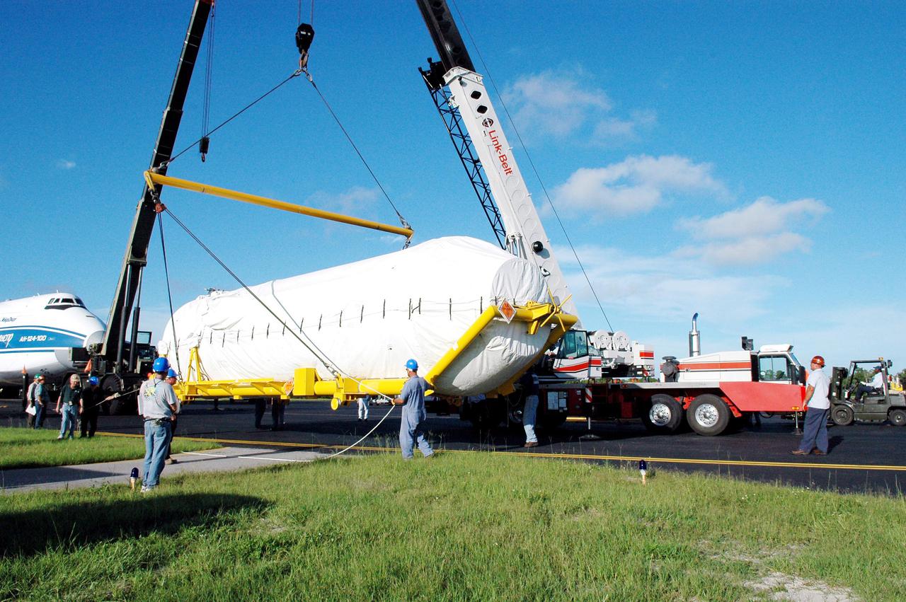 KENNEDY SPACE CENTER, FLA.  -  At the Cape Canaveral Air Force Station Skid Strip, a large crane is attached to the offloaded second stage Centaur (Block I) to lift and place it on a flat bed truck.  The Centaur arrived on a Russian Antonov AH-124-100 cargo airplane.  The Centaur upper stage will be mated with the Lockheed Martin Atlas V, designated AV-007, that is the launch vehicle for the Mars Reconnaissance Orbiter (MRO). The MRO is designed for a series of global mapping, regional survey and targeted observations from a near-polar, low-altitude Mars orbit. These observations will be unprecedented in terms of the spatial resolution and coverage achieved by the orbiter’s instruments as they observe the atmosphere and surface of Mars while probing its shallow subsurface as part of a “follow the water” strategy.  The orbiter is undergoing environmental tests in facilities at Lockheed Martin Space Systems in Denver, Colo., and is on schedule for a launch window that begins Aug. 10. Launch will be from Launch Complex 41 at Cape Canaveral Air Force Station in Florida.