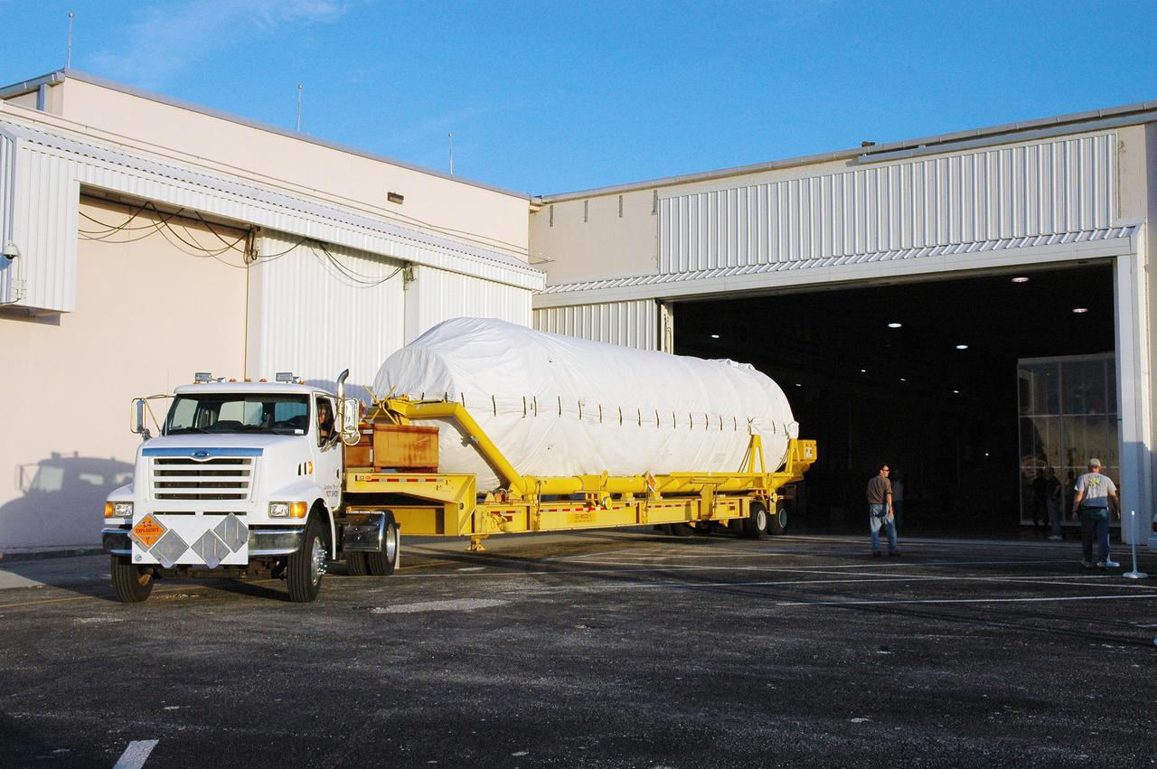 KENNEDY SPACE CENTER, FLA.  -  The Centaur (Block I) upper stage is rolled into the hangar of the Atlas Space Operations Center where it will be processed for mating with the Lockheed Martin Atlas V, designated AV-007, that is the launch vehicle for the Mars Reconnaissance Orbiter (MRO).  The MRO is designed for a series of global mapping, regional survey and targeted observations from a near-polar, low-altitude Mars orbit. These observations will be unprecedented in terms of the spatial resolution and coverage achieved by the orbiter’s instruments as they observe the atmosphere and surface of Mars while probing its shallow subsurface as part of a “follow the water” strategy.  The orbiter is undergoing environmental tests in facilities at Lockheed Martin Space Systems in Denver, Colo., and is on schedule for a launch window that begins Aug. 10. Launch will be from Launch Complex 41 at Cape Canaveral Air Force Station in Florida.