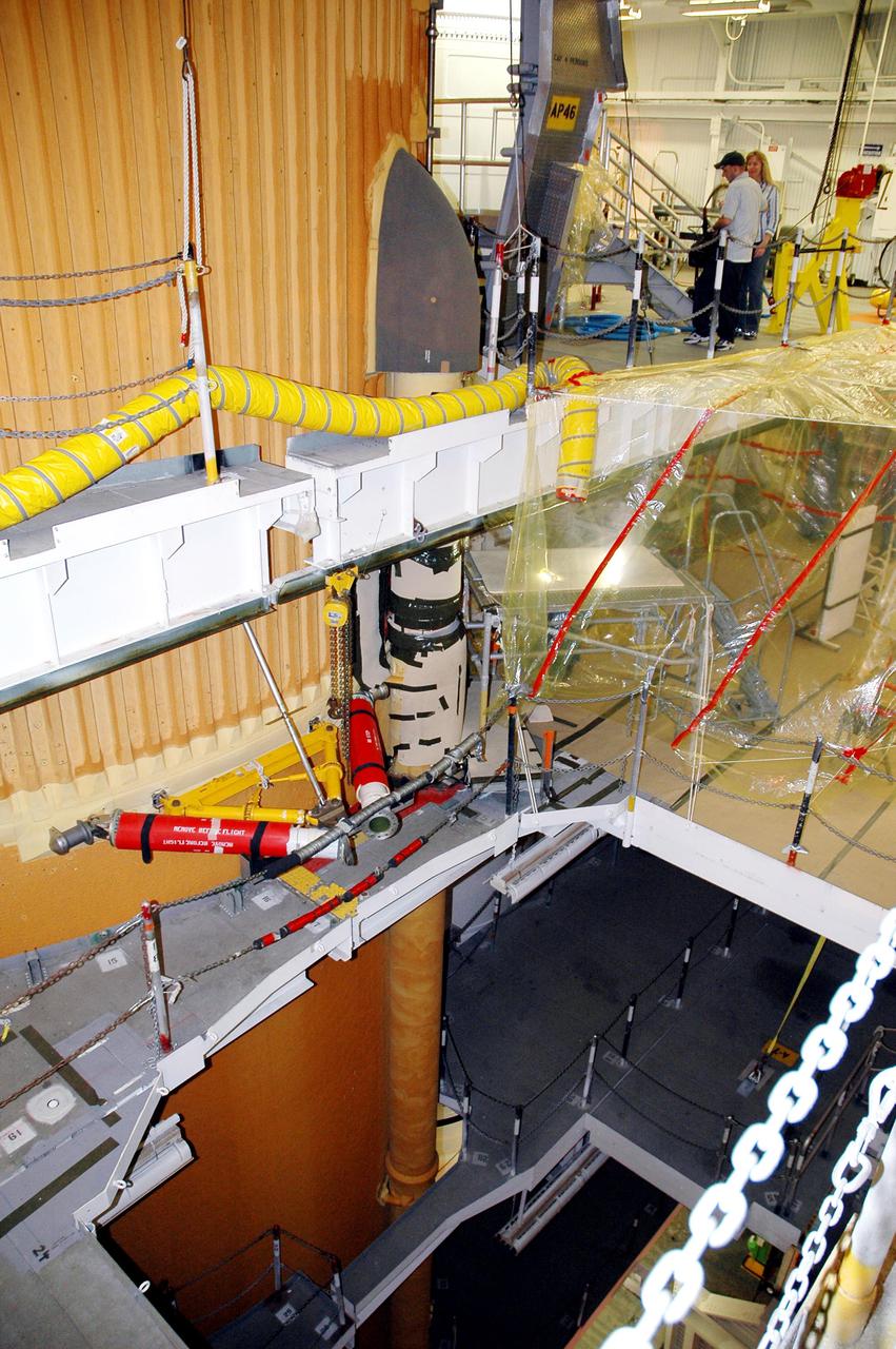 KENNEDY SPACE CENTER, FLA. -In the Vehicle Assembly Building at NASA’s Kennedy Space Center, the newly installed liquid oxygen bellows heater is seen on External Tank 120 (at left, behind it), recently removed from the orbiter Discovery. The new heater has been added to the feedline bellows to minimize the potential for ice and frost buildup.  ET-120 will fly with Atlantis on the second Return to Flight mission STS-121.  The launch window for STS-121 extends from Sept. 9 - 24.