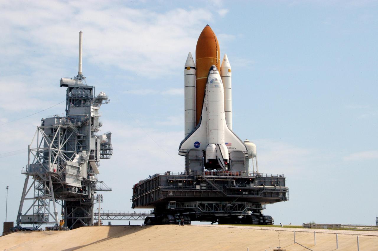 KENNEDY SPACE CENTER, FLA. - Space Shuttle Discovery makes its way up the 5 percent grade to the hardstand of Launch Pad 39B. First motion for the 4.2-mile journey was at 1:58 a.m. EDT. The Space Shuttle rests on a Mobile Launcher Platform that sits atop a Crawler-Transporter. This is the second rollout of Discovery. The orbiter was returned to the Vehicle Assembly Building for connection to an improved External Tank. Launch of Discovery on its Return to Flight mission STS-114 is targeted for a launch window extending from July 13 to July 31.
