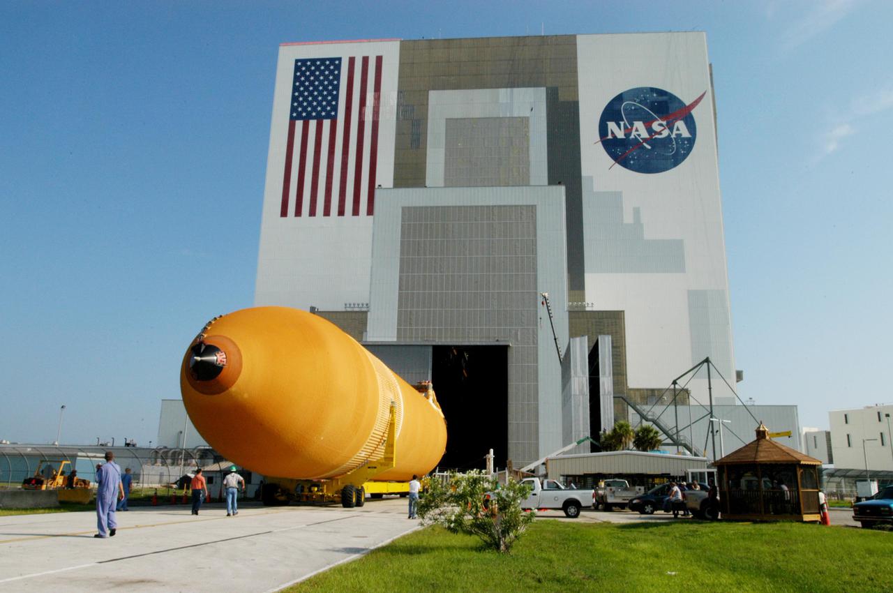 KENNEDY SPACE CENTER, FLA. - A newly redesigned External Tank (ET-119) rolls toward the Vehicle Assembly Building after arrival aboard a barge at the Turn Basin in Launch Complex 39 Area at Kennedy Space Center, Florida.  The tank will be used on a future Space Shuttle launch.   The barge was towed on a 900-mile journey at sea from the Michoud Assembly Facility in New Orleans by one of NASA’s Solid Rocket Booster Retrieval Ships.