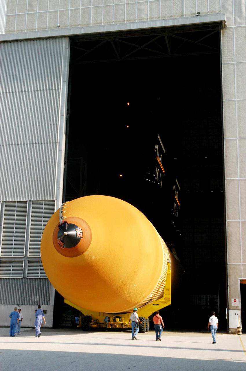 KENNEDY SPACE CENTER, FLA. -A newly redesigned External Tank (ET-119) rolls into the transfer aisle of the Vehicle Assembly Building.  The tank, which will be used on a future Space Shuttle launch, arrived aboard a barge at the Turn Basin in Launch Complex 39 Area at Kennedy Space Center, Florida.   The barge was towed on a 900-mile journey at sea from the Michoud Assembly Facility in New Orleans by one of NASA’s Solid Rocket Booster Retrieval Ships.