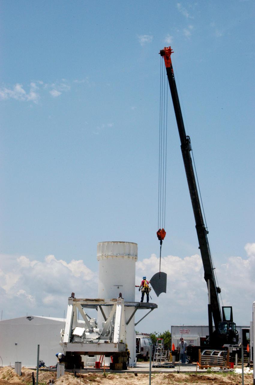 KENNEDY SPACE CENTER, FLA. - On June 8, the base for a C-band radar antenna is being constructed at a radar site on North Merritt Island, Fla.  The 50-foot C-band radar will be used for long-term Shuttle missions to track the launches and observe possible debris coming from the Shuttle.  The launch window for the first Return to Flight mission, STS-114,  is July 13 to July 31.