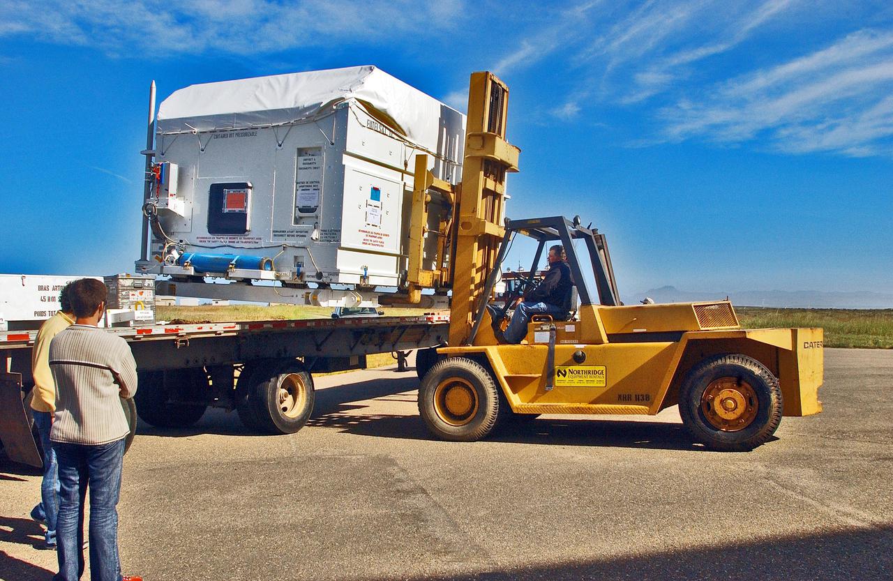 KENNEDY SPACE CENTER, FLA. - At Vandenberg Air Force Base in California, the newly arrived Cloud-Aerosol Lidar and Infrared Pathfinder Satellite Observation (CALIPSO) spacecraft leaves the airstrip for transport to the VAFB Astrotech Payload Processing Facility. CALIPSO will fly in combination with the CloudSat satellite to provide never-before-seen 3-D perspectives of how clouds and aerosols form, evolve, and affect weather and climate. CALIPSO and CloudSat will join three other satellites in orbit to enhance understanding of climate systems. The launch date for CALIPSO_CloudSat is no earlier than Aug. 22.