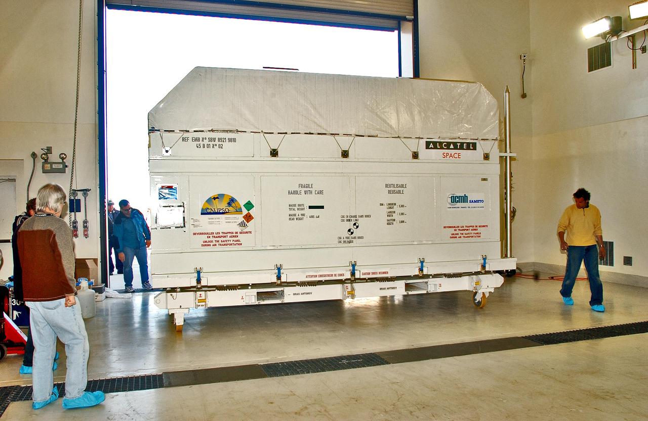 KENNEDY SPACE CENTER, FLA. - At the Astrotech Payload Processing Facility on Vandenberg Air Force Base in California, the newly arrived Cloud-Aerosol Lidar and Infrared Pathfinder Satellite Observation (CALIPSO) is moved inside. CALIPSO will fly in combination with the CloudSat satellite to provide never-before-seen 3-D perspectives of how clouds and aerosols form, evolve, and affect weather and climate. CALIPSO and CloudSat will join three other satellites in orbit to enhance understanding of climate systems. The launch date for CALIPSO_CloudSat is no earlier than Aug. 22.