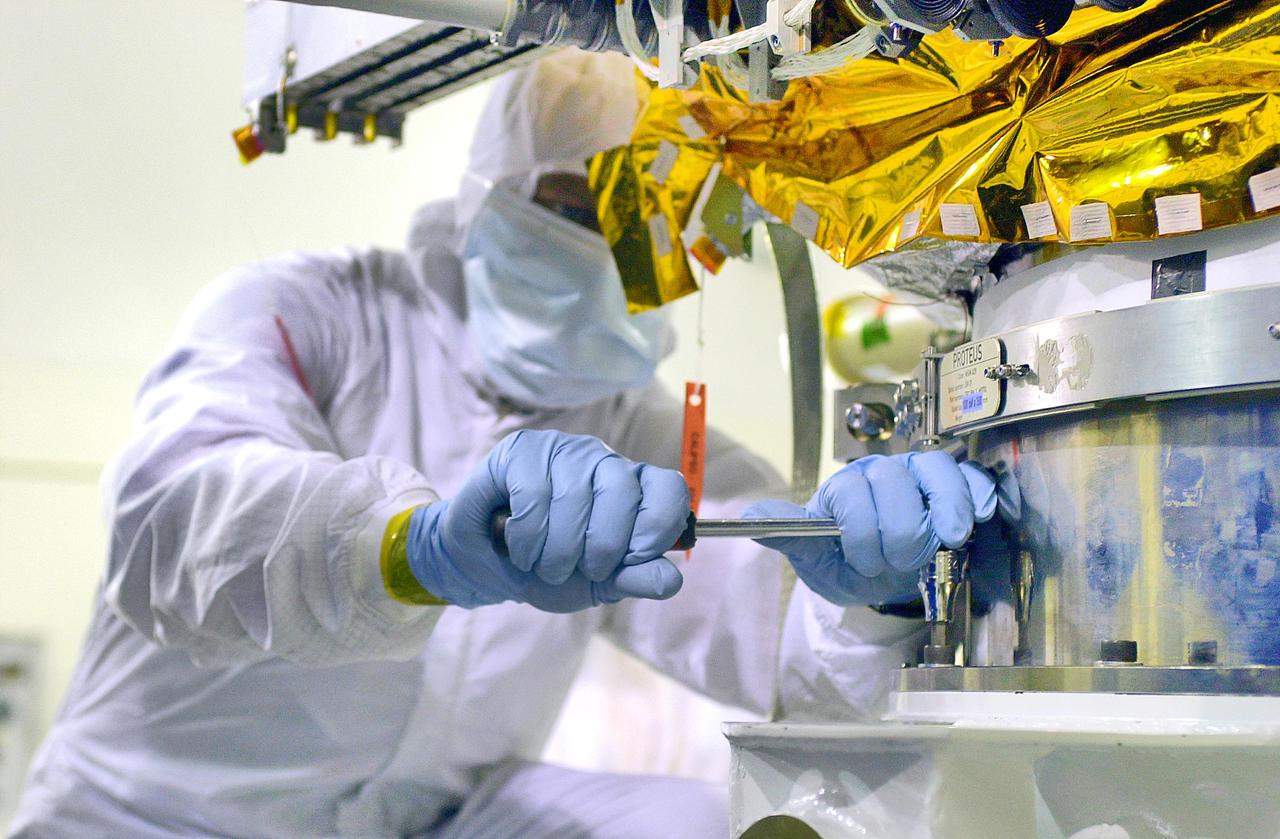 KENNEDY SPACE CENTER, FLA. -Inside the Astrotech Payload Processing Facility on Vandenberg Air Force Base in California, workers prepare the Cloud-Aerosol Lidar and Infrared Pathfinder Satellite Observation (CALIPSO) spacecraft to be lifted and transferred to a workstand. CALIPSO will undergo state-of-health checks, and electrical ground-support equipment testing. CALIPSO will fly in combination with the CloudSat satellite to provide never-before-seen 3-D perspectives of how clouds and aerosols form, evolve, and affect weather and climate. CALIPSO and CloudSat will join three other satellites in orbit to enhance understanding of climate systems. The launch date for CALIPSO_CloudSat is no earlier than Aug. 22.