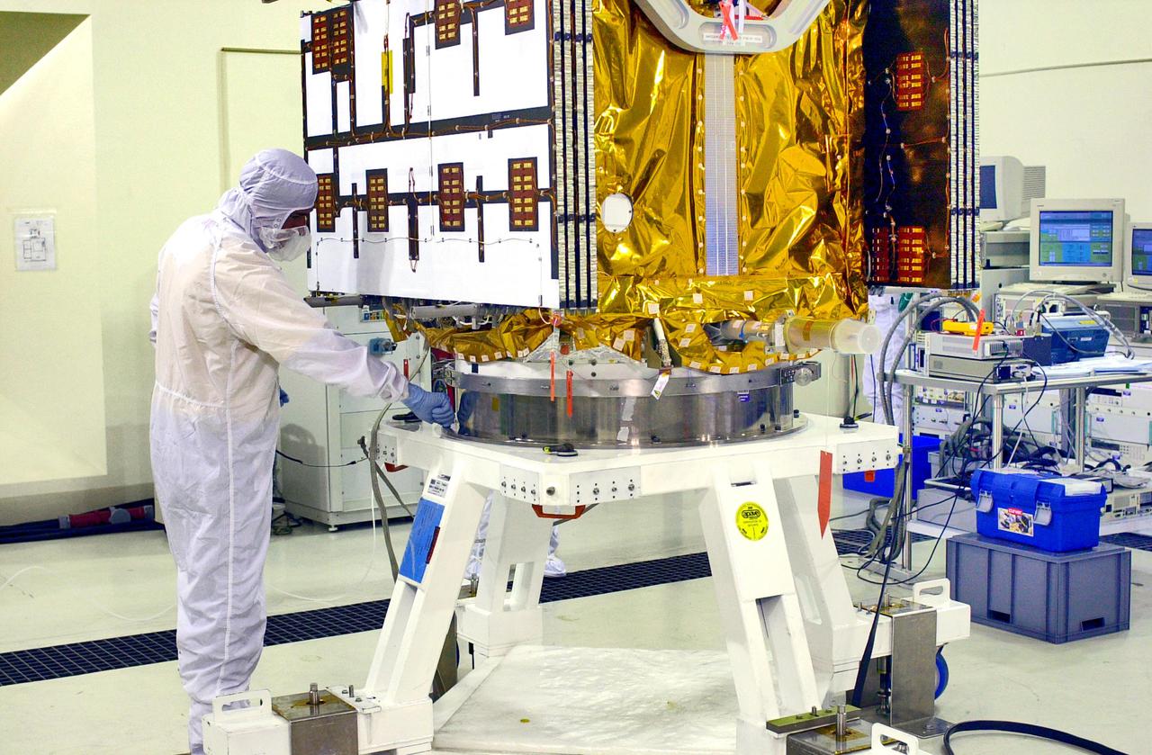 KENNEDY SPACE CENTER, FLA. - Inside the Astrotech Payload Processing Facility on Vandenberg Air Force Base in California, workers secure the Cloud-Aerosol Lidar and Infrared Pathfinder Satellite Observation (CALIPSO) spacecraft onto a workstand. CALIPSO will undergo state-of-health checks, and electrical ground-support equipment testing. CALIPSO will fly in combination with the CloudSat satellite to provide never-before-seen 3-D perspectives of how clouds and aerosols form, evolve, and affect weather and climate. CALIPSO and CloudSat will join three other satellites in orbit to enhance understanding of climate systems. The launch date for CALIPSO_CloudSat is no earlier than Aug. 22.