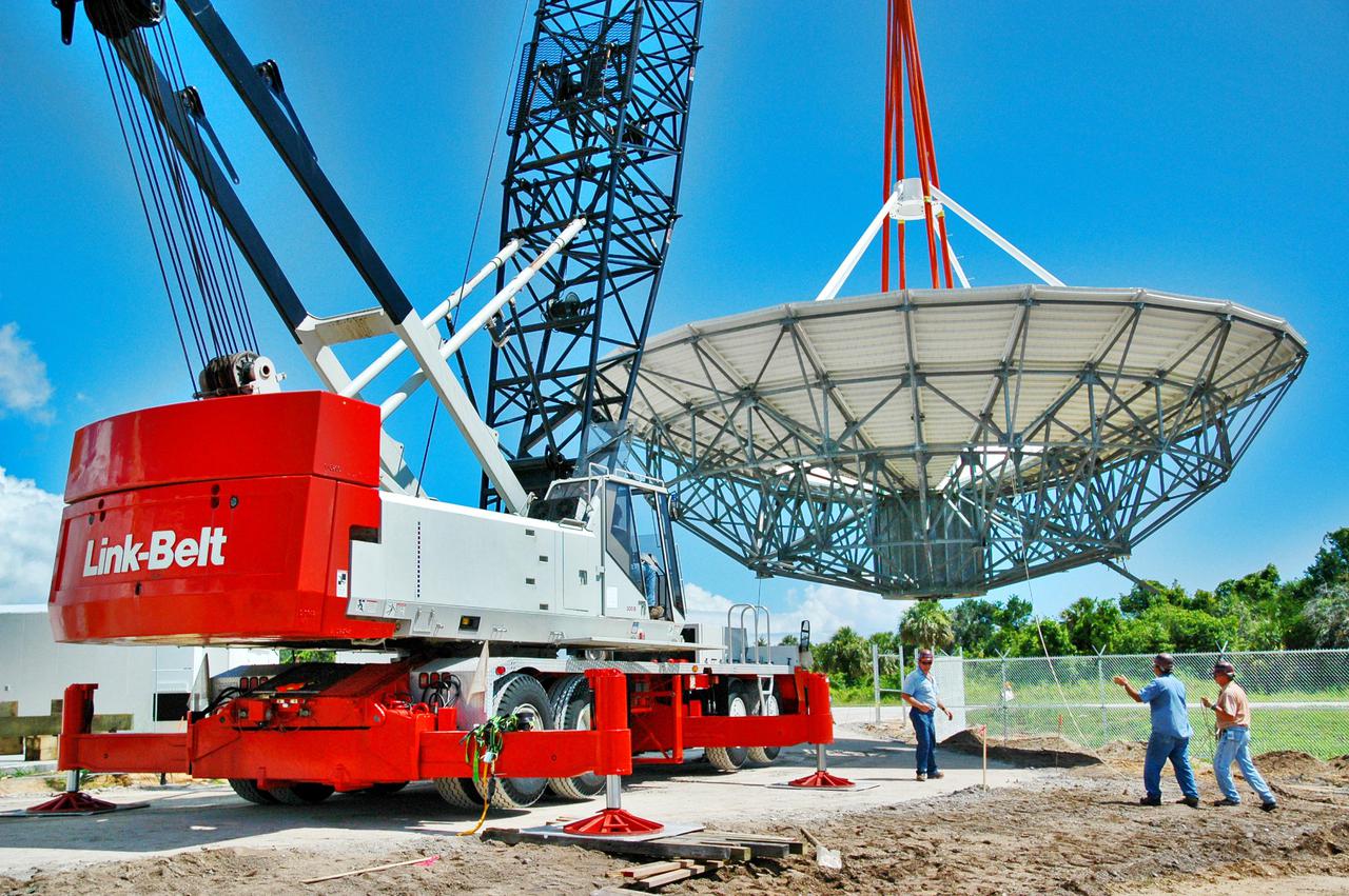 KENNEDY SPACE CENTER, FLA. - At a radar site on North Merritt Island, Fla., the 50-foot C-band radar antenna dish is lifted off the ground.  It will be placed onto the top of a support structure.The radar will be used for Shuttle missions to track the launches and observe possible debris coming from the Shuttle.  It will be used for the first time on STS-114. The launch window for the first Return to Flight mission is July 13 to July 31.