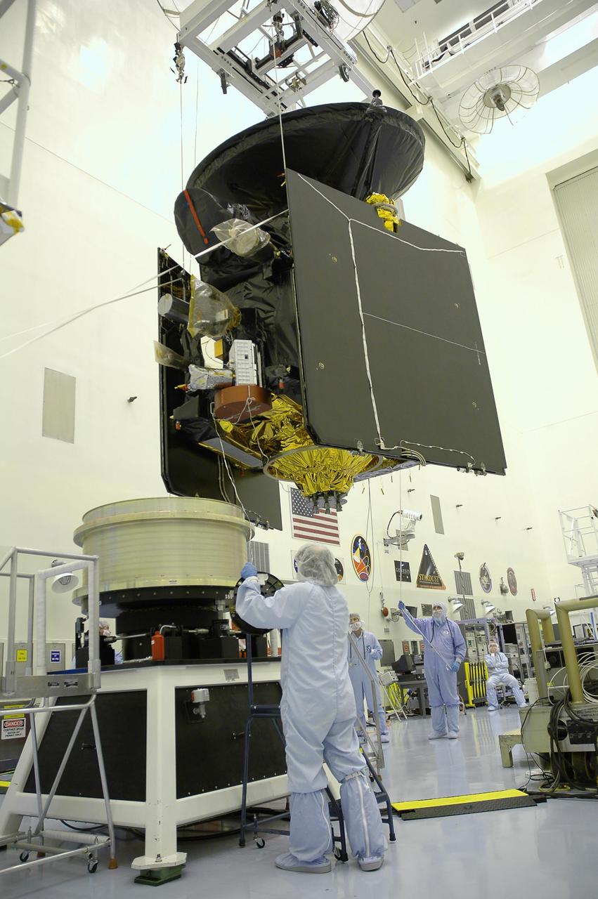 KENNEDY SPACE CENTER, FLA. -- In the Payload Hazardous Servicing Facility, workers from Lockheed Martin guide the suspended Mars Reconnaissance Orbiter (MRO) toward the spin balance machine for testing. In late July, the MRO will be transported to the Vertical Installation Facility. It will join the Atlas V for the final phase of launch preparations. The spacecraft is then scheduled to undergo a functional test, and a final week of integrated testing and closeouts. The MRO was built by Lockheed Martin for the Jet Propulsion Laboratory in California. It is the next major step in Mars exploration and scheduled for launch from Cape Canaveral Air Force Station in a window opening Aug. 10. The MRO is an important next step in fulfilling NASA’s vision of space exploration and ultimately sending human explorers to Mars and beyond.