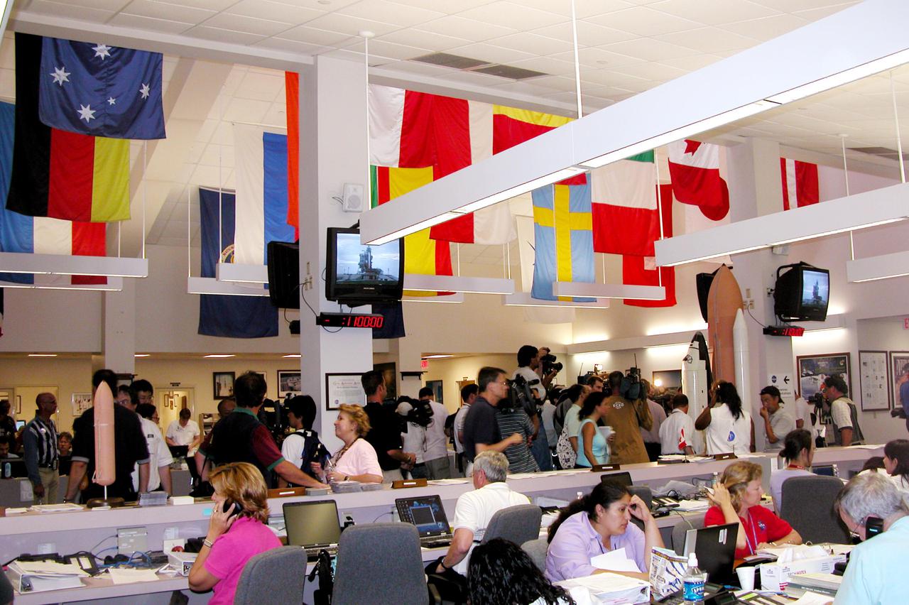 KENNEDY SPACE CENTER, FLA. -  News media representatives arrive in the NASA Newsroom to cover the launch of Space Shuttle Discovery on Return to Flight mission STS-114. The countdown is under way for an anticipated liftoff at 3:51 p.m. EDT July 13.  During its 12-day mission, Discovery’s seven-person crew will test new hardware and techniques to improve Shuttle safety, as well as deliver supplies to the International Space Station.