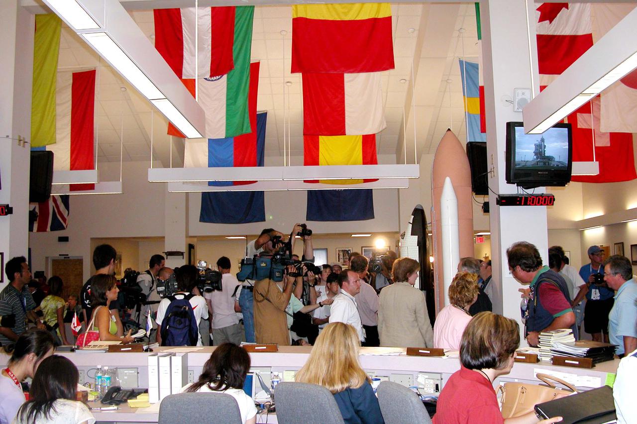 KENNEDY SPACE CENTER, FLA. -  News media gather in the NASA Newsroom to cover the countdown for the launch of Space Shuttle Discovery on Return to Flight mission STS-114.  Liftoff is planned for 3:51 p.m. EDT July 13.  During its 12-day mission, Discovery’s seven-person crew will test new hardware and techniques to improve Shuttle safety, as well as deliver supplies to the International Space Station.