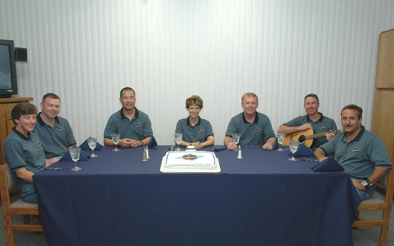 KENNEDY SPACE CENTER, FLA. - The Return to Flight STS-114 crew sits for the traditional launch day breakfast in the Operations and Checkout Building. Seated left to right are Mission Specialist Wendy Lawrence, Pilot James Kelly, Mission Specialist Soichi Noguchi, Mission Commander Eileen Collins, and Mission Specialists Andrew Thomas, Stephen Robinson and Charles Camarda. They are scheduled to launch on this historic mission aboard Space Shuttle Discovery at 3:51 p.m. EDT today from Launch Pad 39B. It is the 114th Space Shuttle flight and the 31st for Discovery. The 12-day mission is expected to end with touchdown at the Shuttle Landing Facility at 11:06 a.m. July 25.